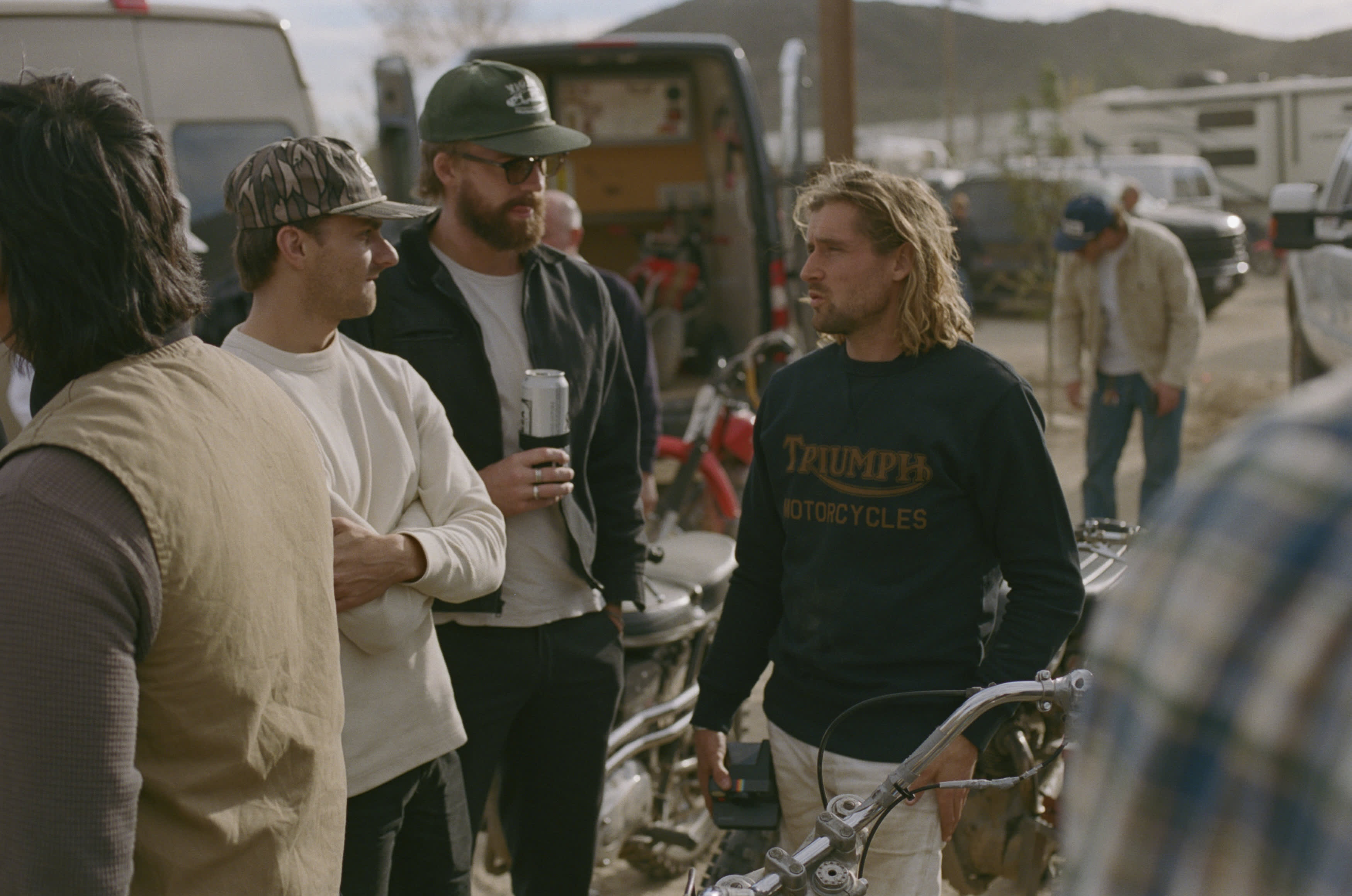 Group of friends at an event, wearing Triumph Motorcycles Heritage Radial Logo Sweatshirt
