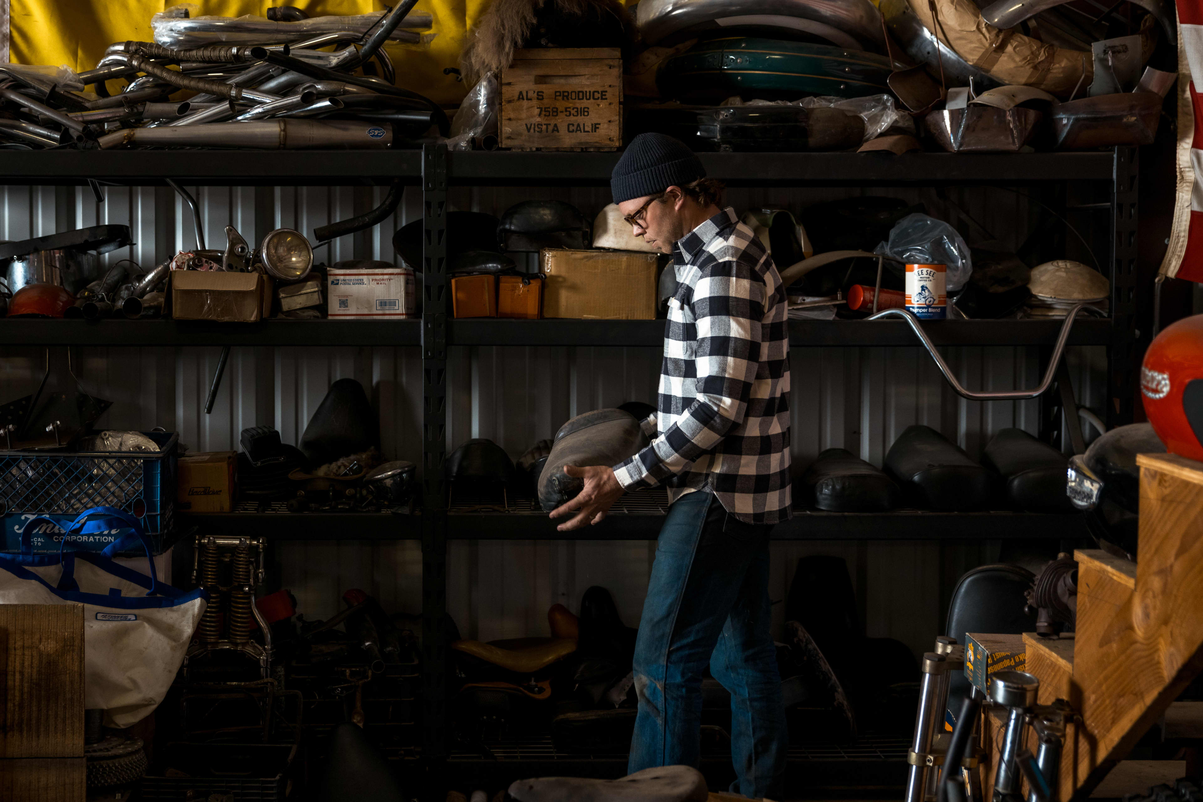 Man in workshop wearing a Triumph Heritage shirt