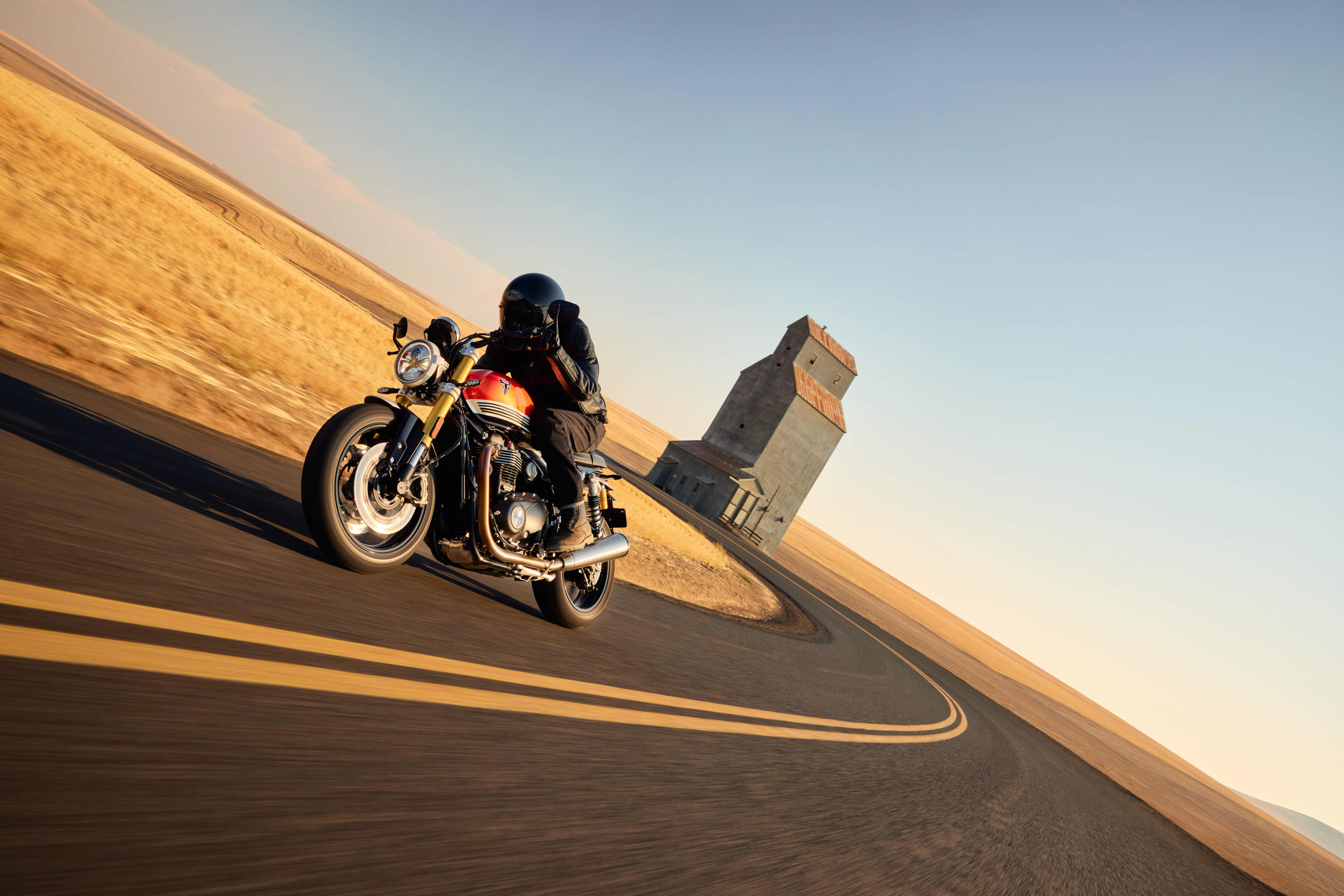 Angled side view riding shot of Triumph Speed Twin 1200 RS