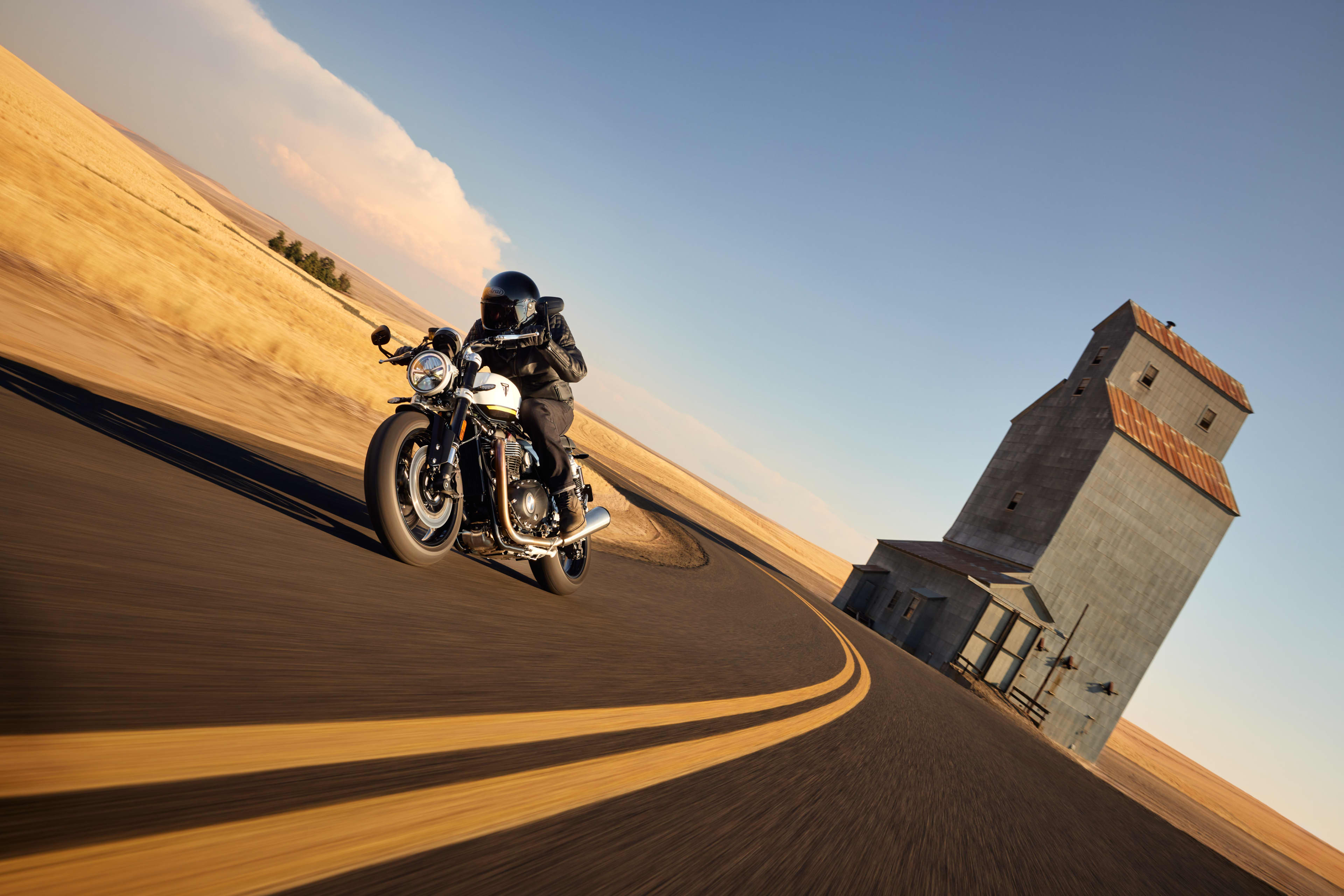 Angled front view riding shot of Triumph Speed Twin 1200