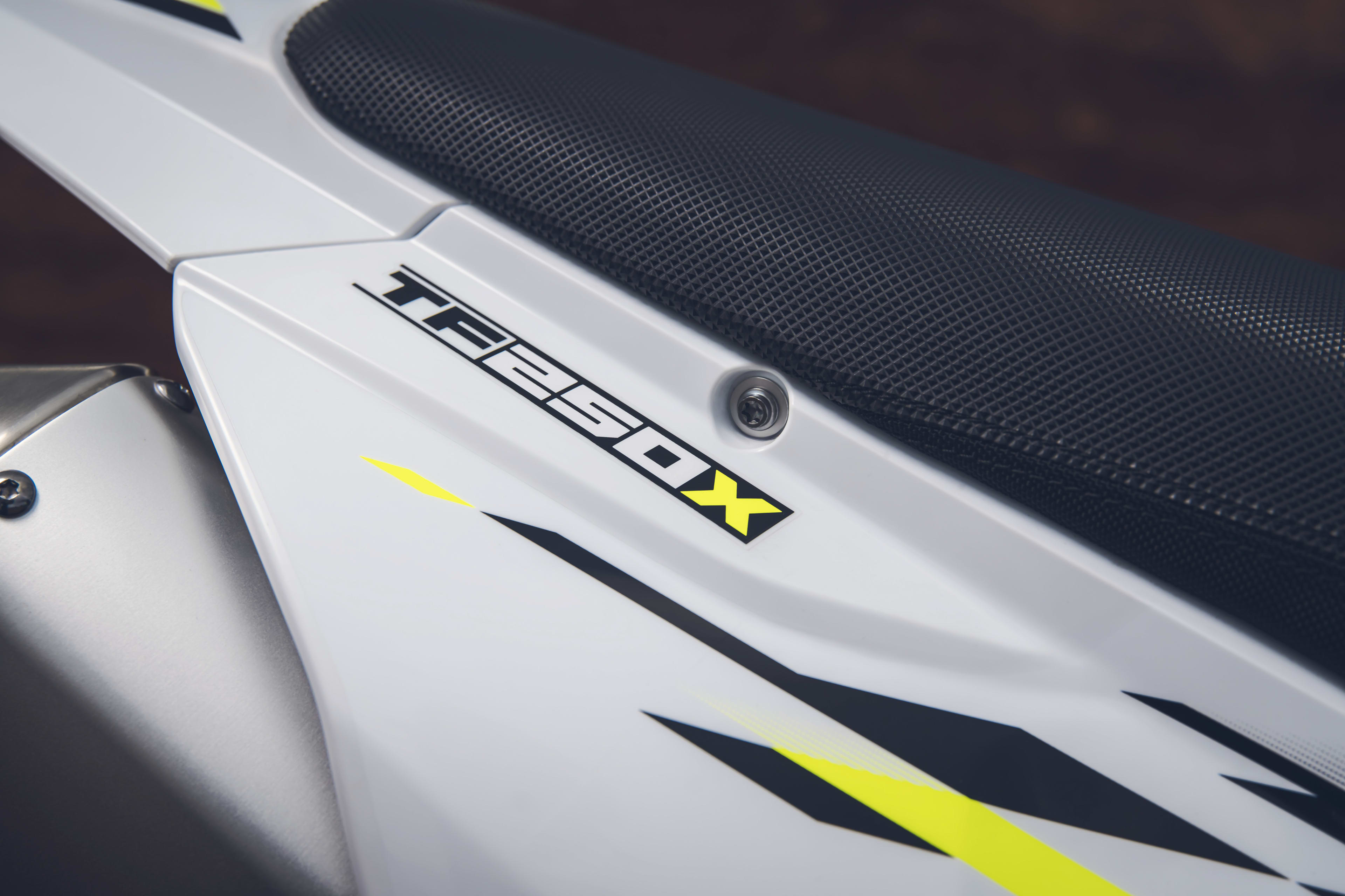 Close up of the Triumph TF 250-X logo under the seat