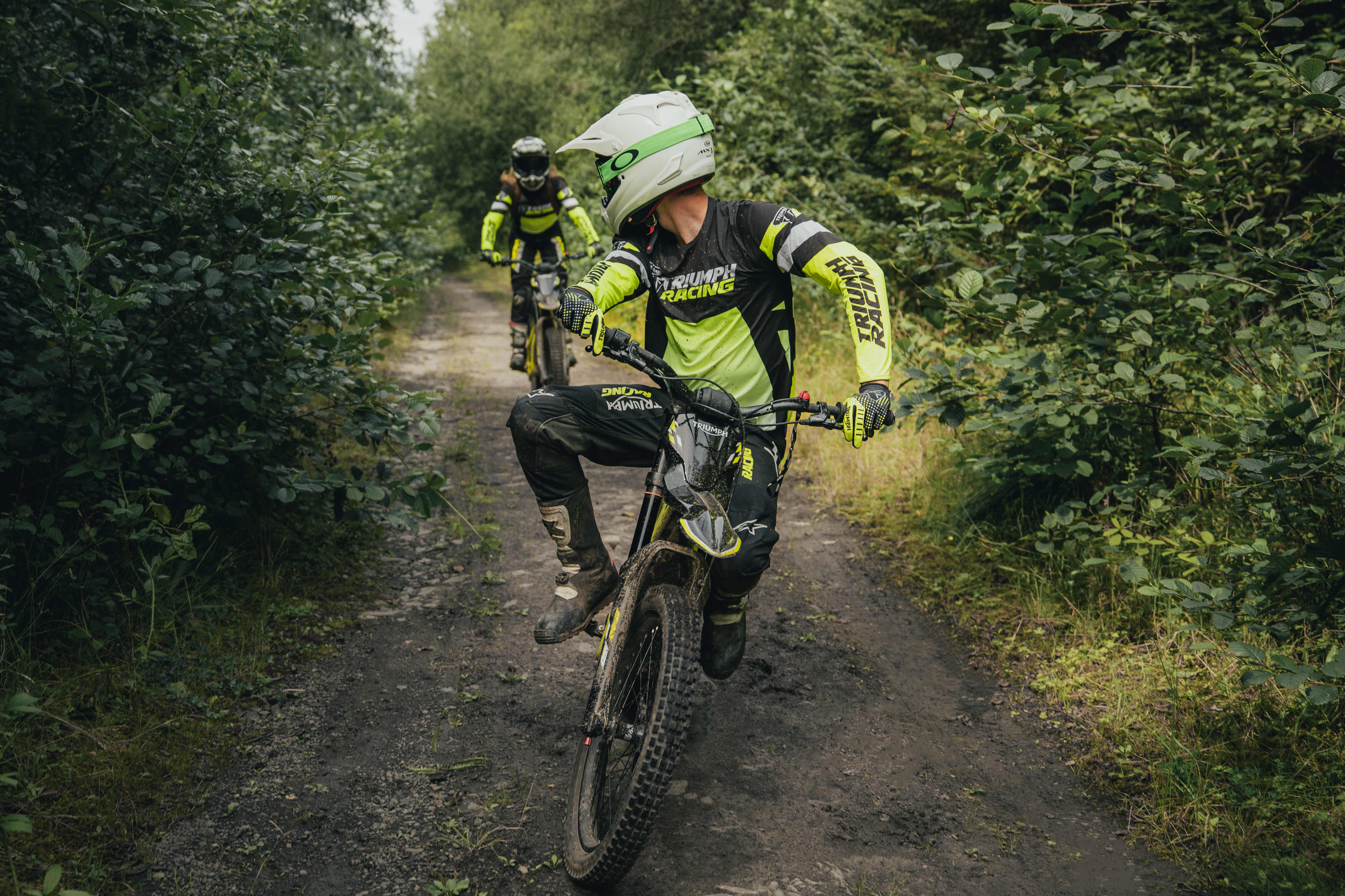 Two riders having fun on the Triumph TXP-24 electric bikes.