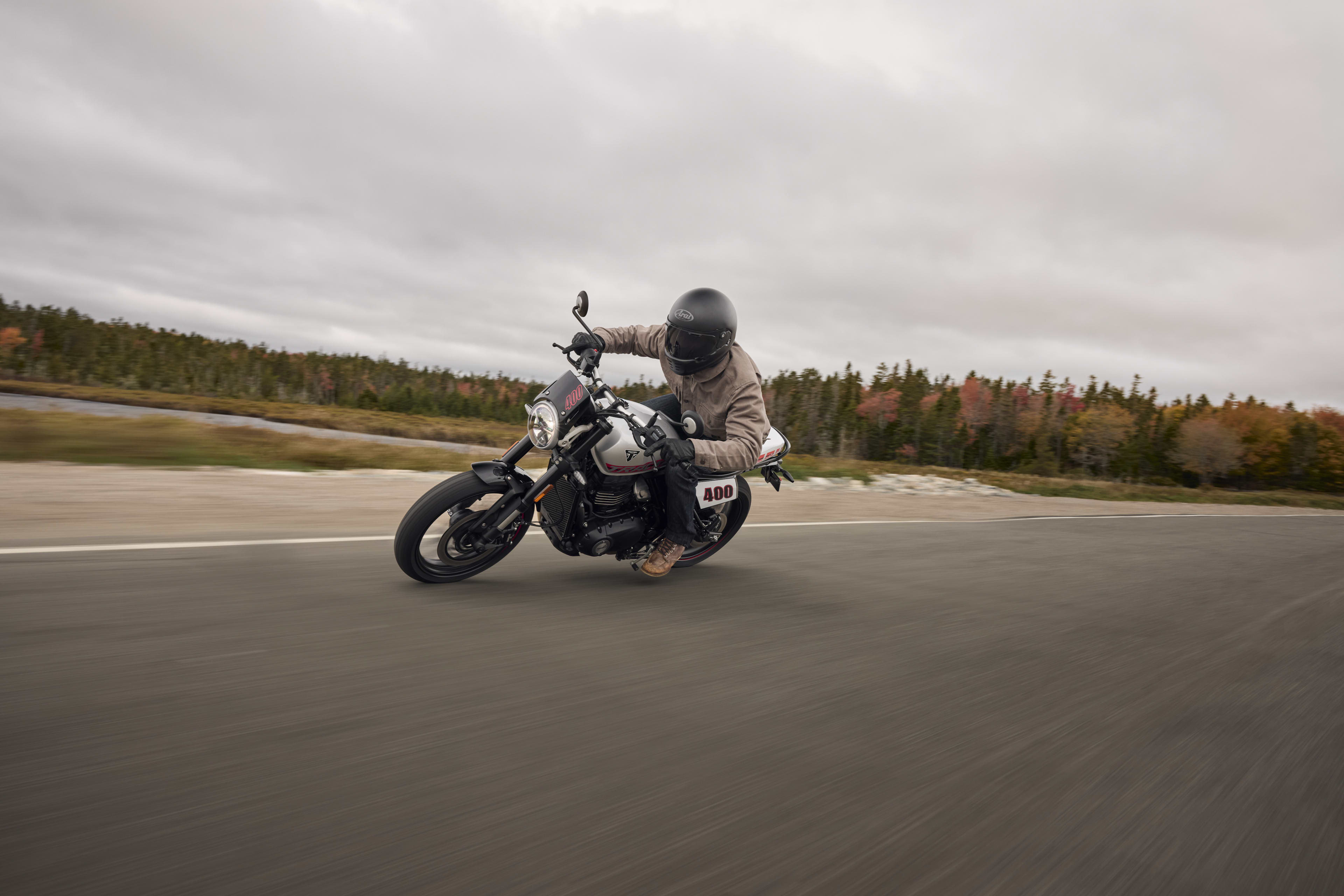 Angled left side riding shot of Tracker 400 on a road