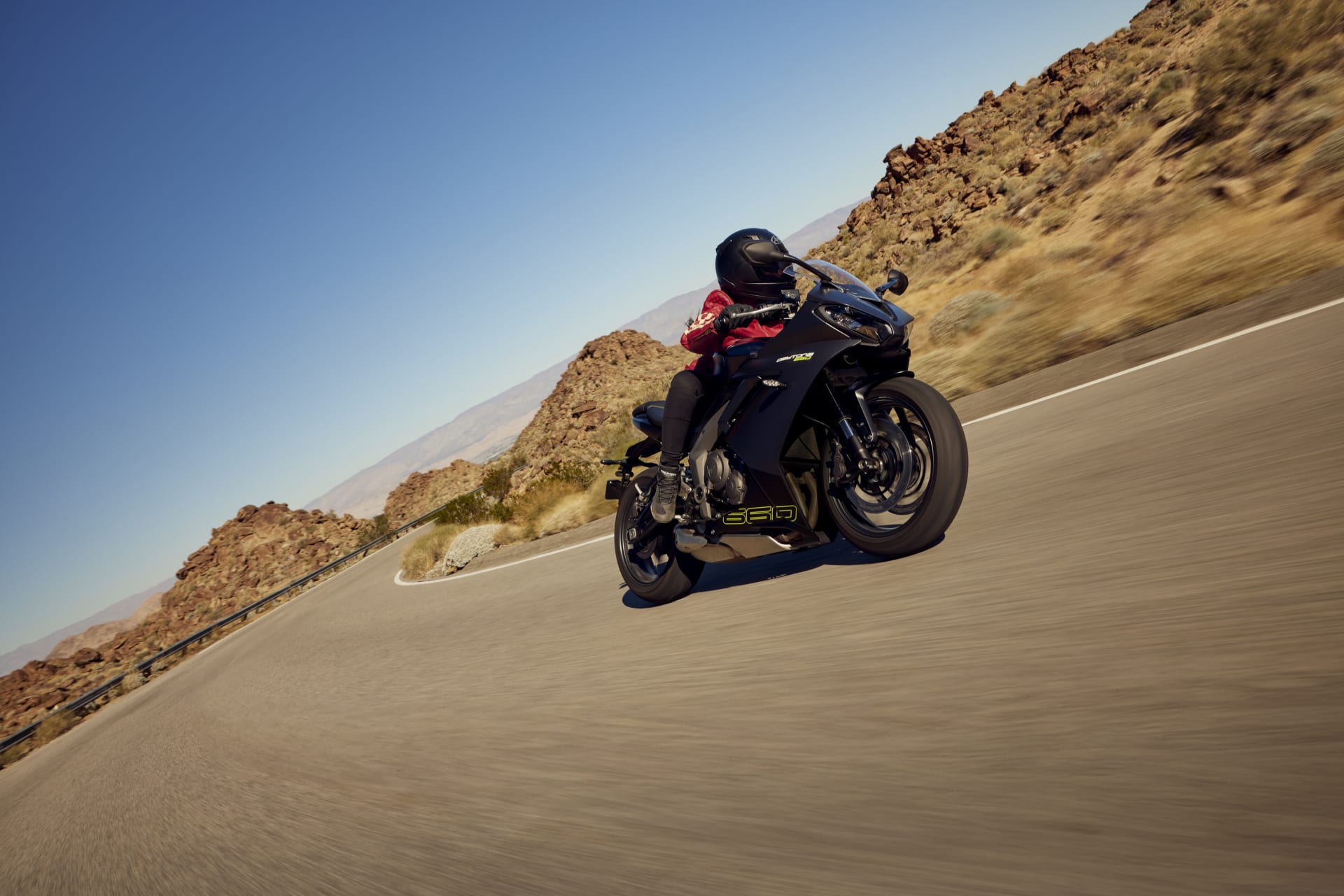 Right side angled view of Rider on Triumph Daytona 660