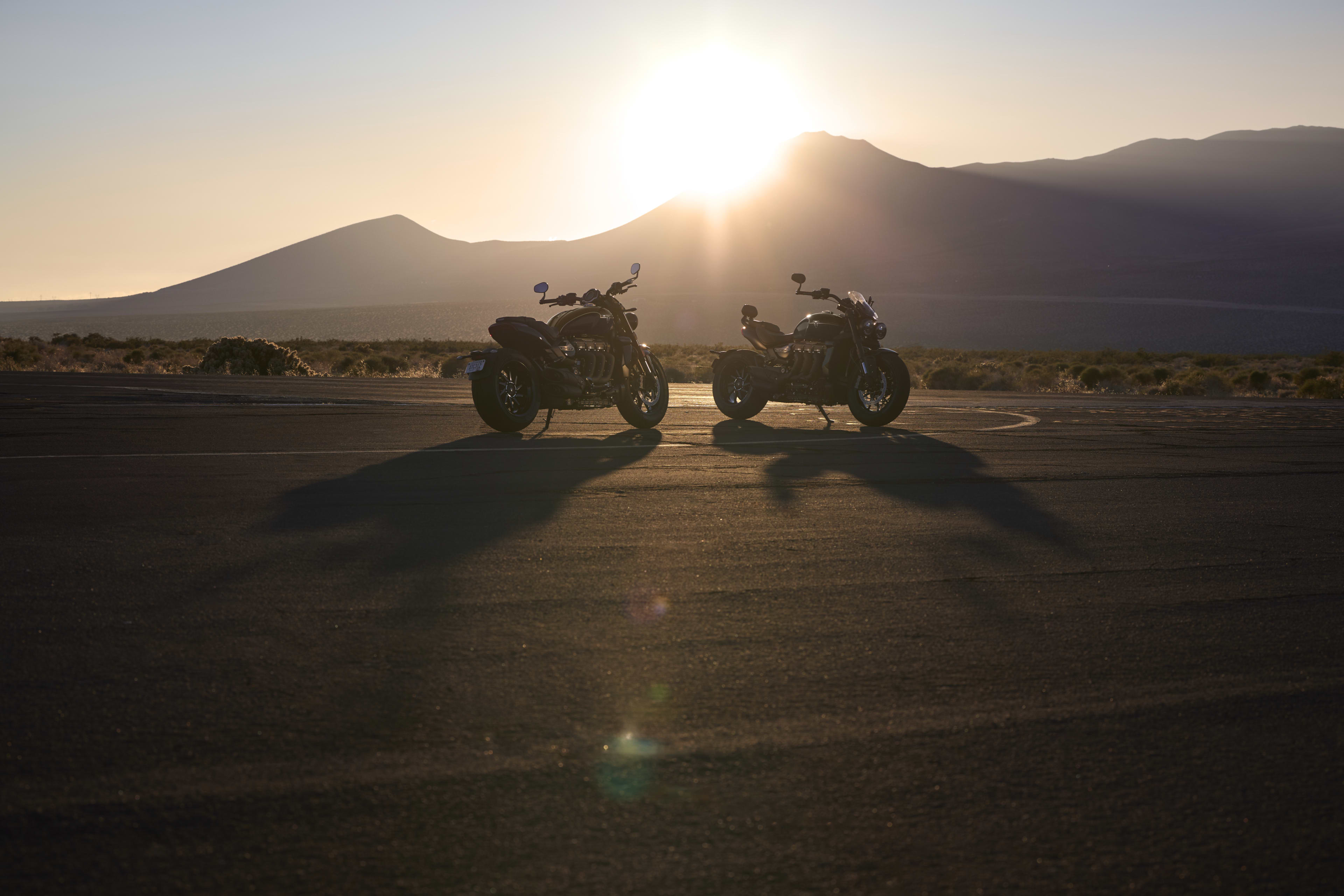 Triumph Rocket 3 Storm R and GT on the road at sunset