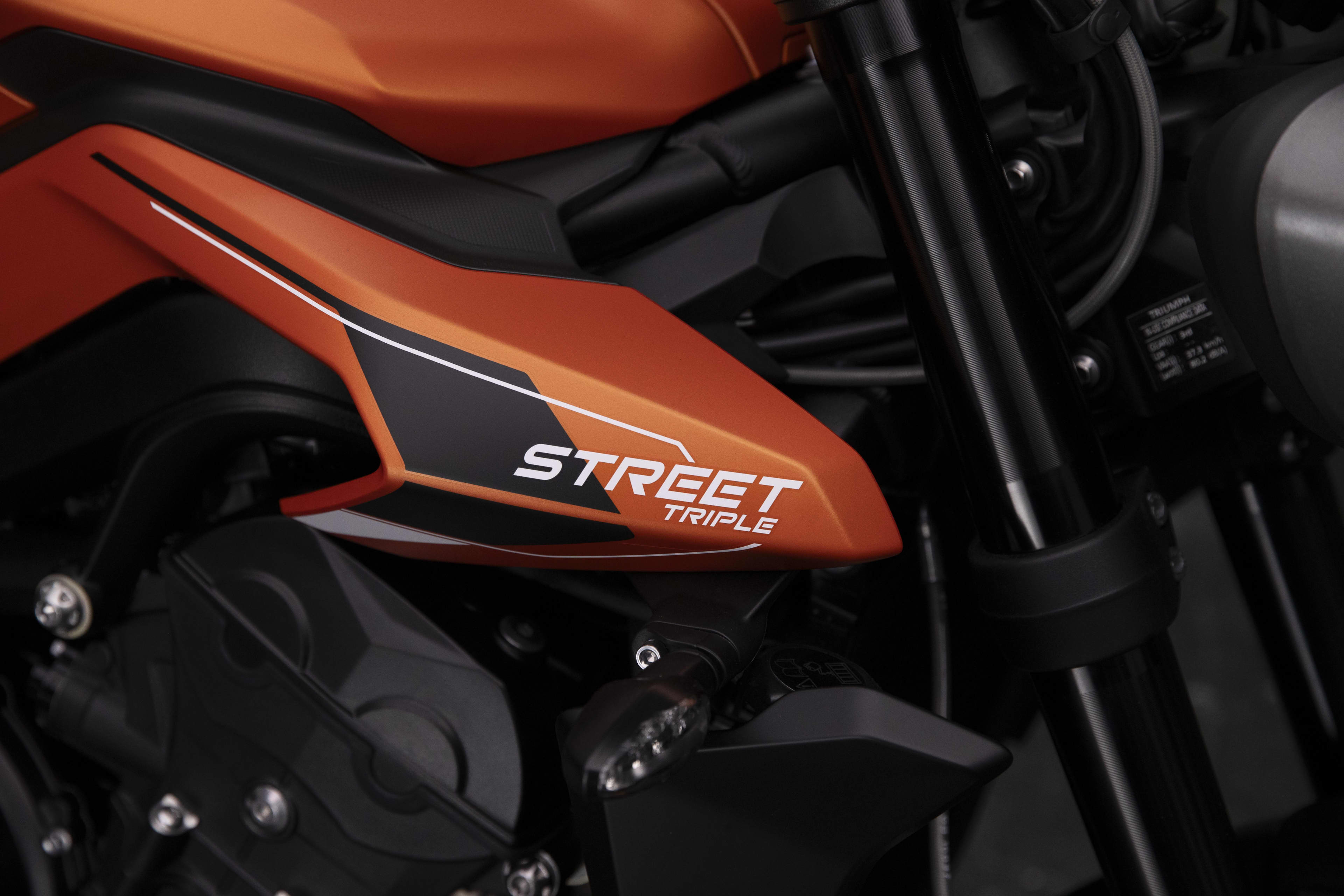 Close up shot of Triumph Street Triple 765 R A2 in Matt Baja Orange