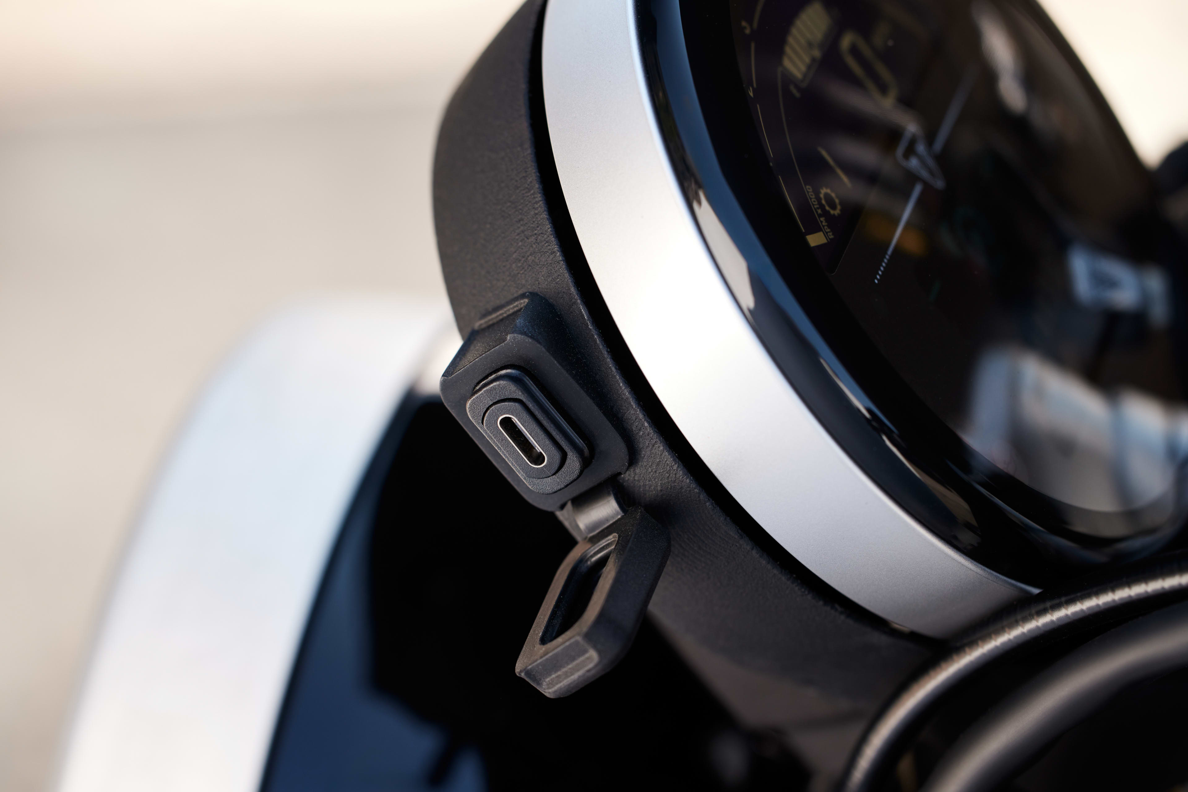 Close up shot of Triumph Speed Twin 1200 USB-C port on the side of the speedometer