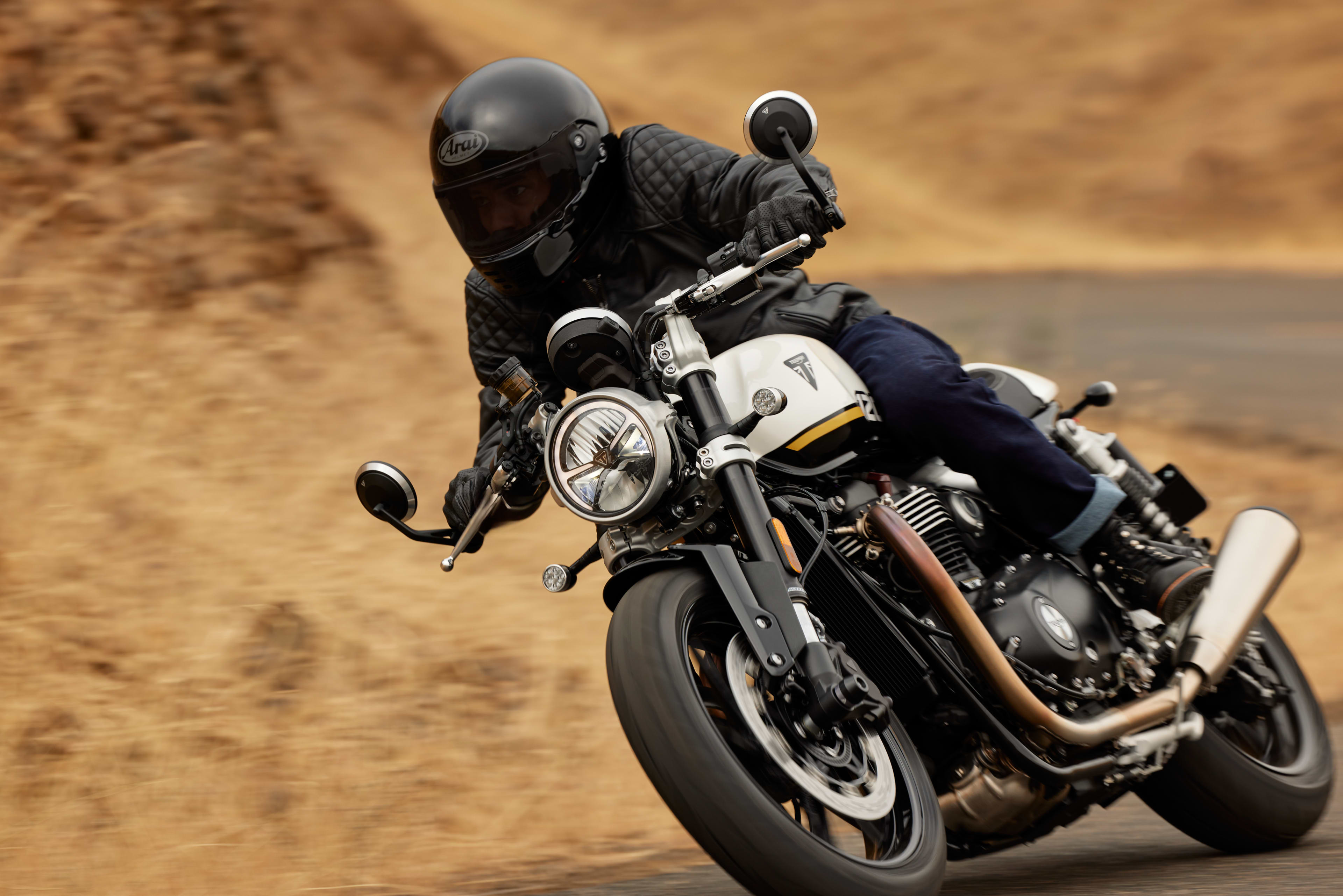 Angled front view riding shot of Triumph speed twin 1200