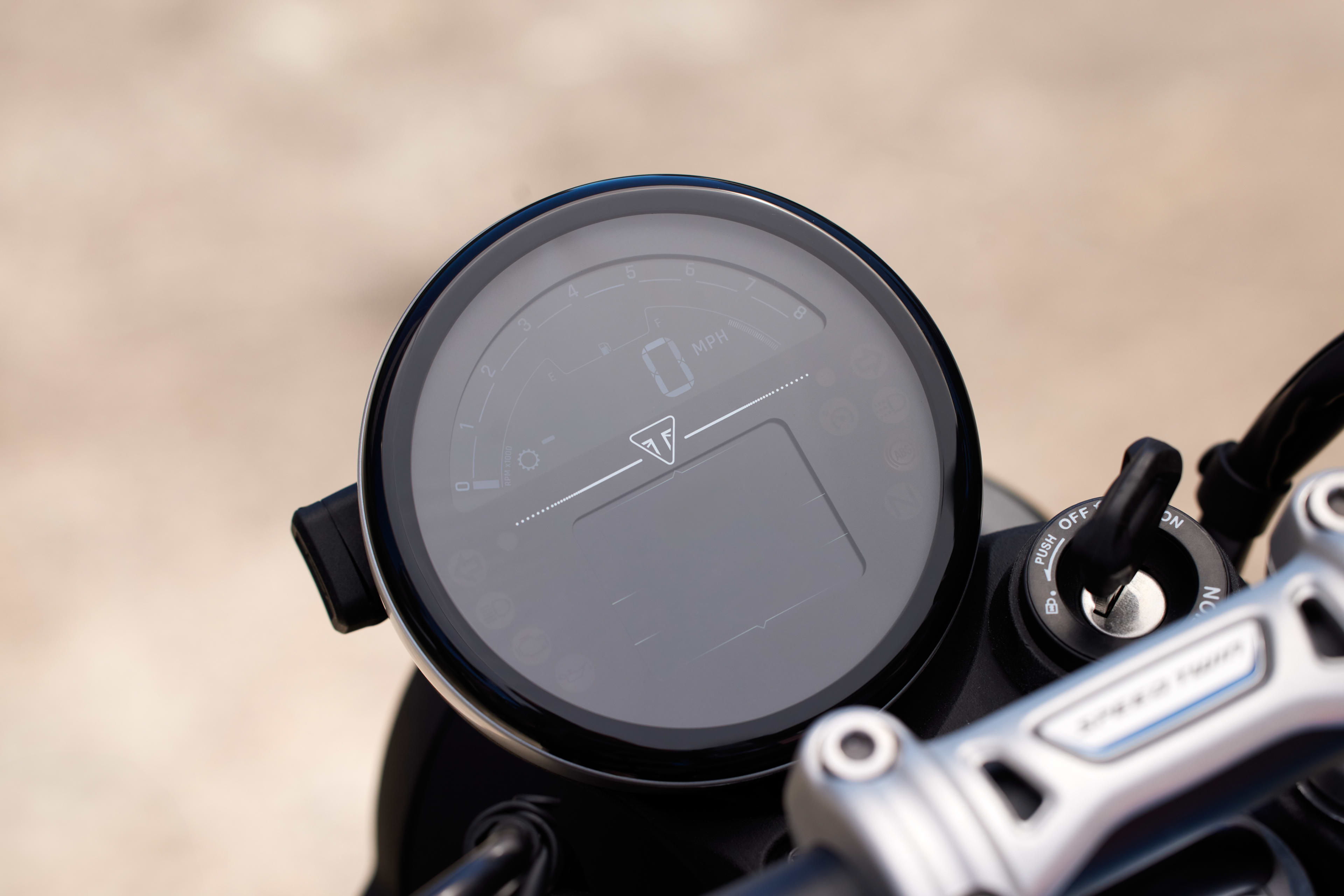 Close up of Triumph Speed Twin 900 digital display and ignition switch
