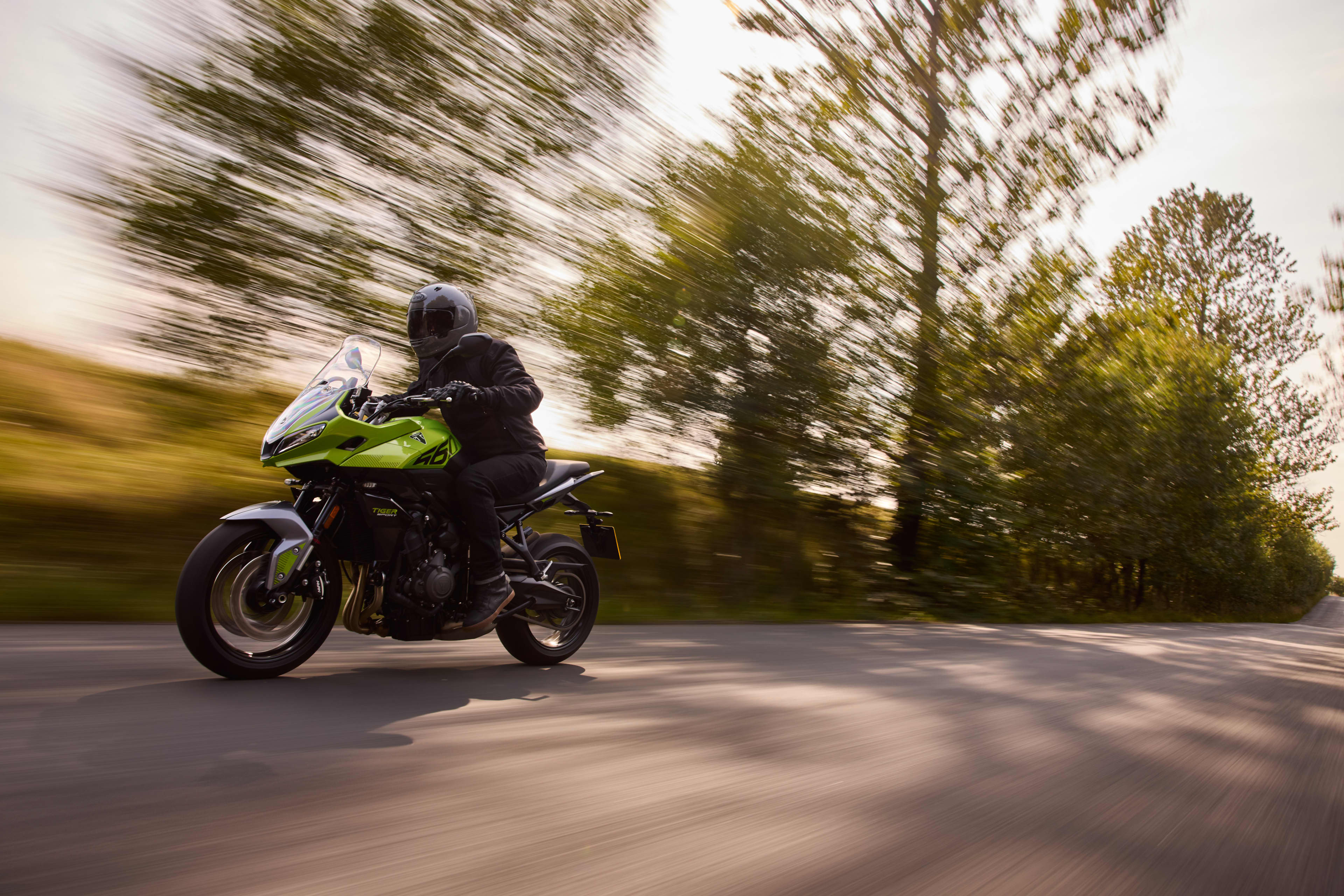 Right hand side of Tiger Sport 800 Tour parked on a road with nature in the background
