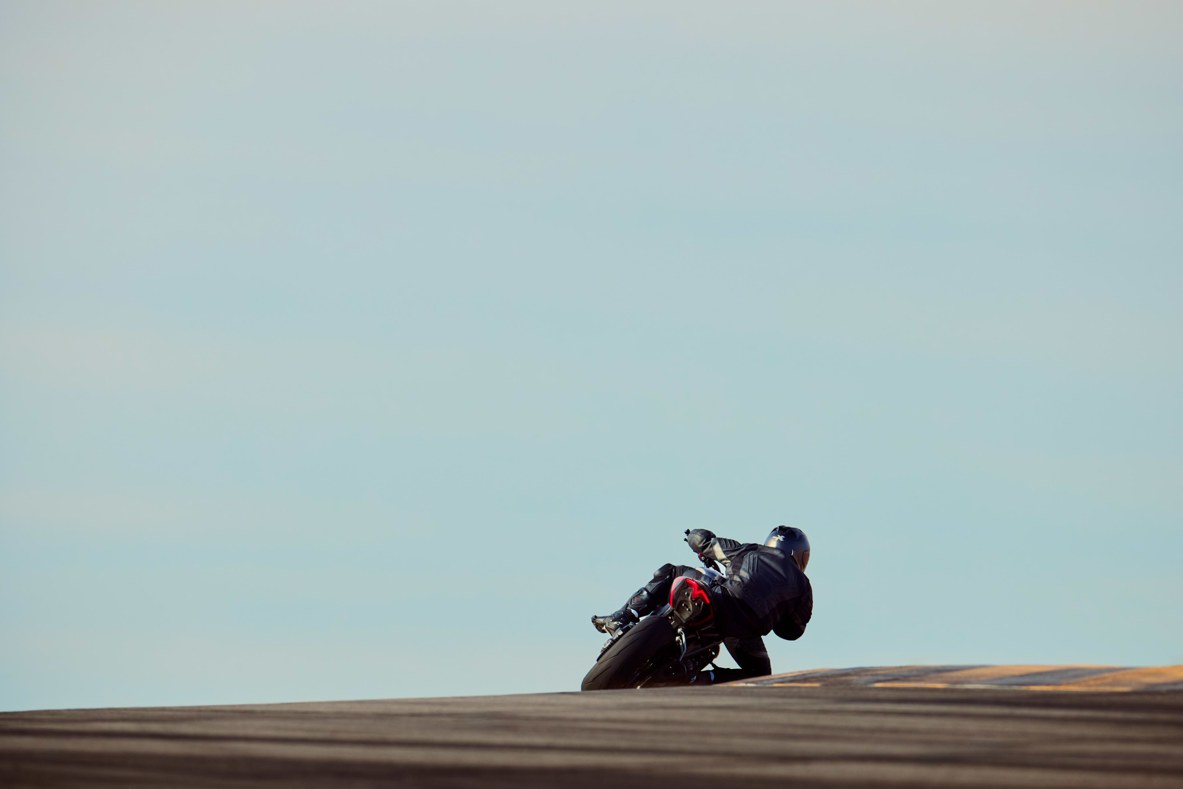 Rear end of the Speed Triple 1200 RS riding into the distance