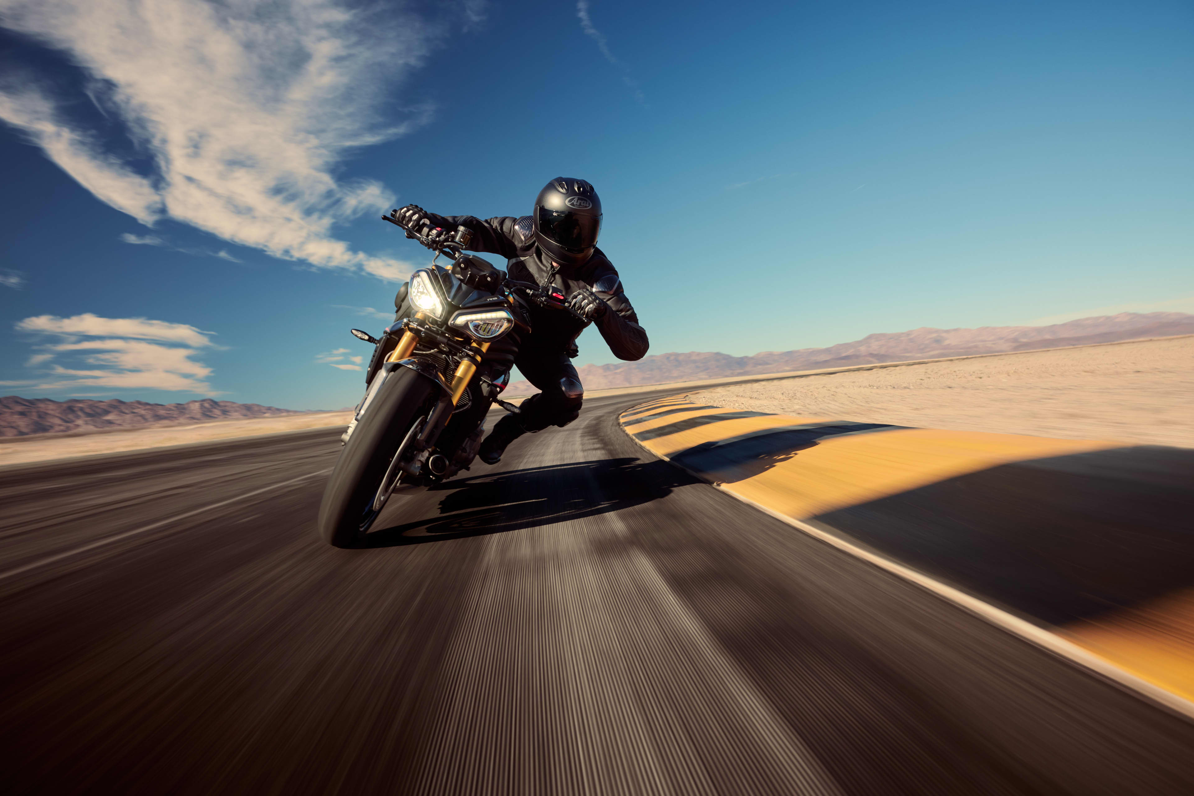 Front view of the Speed Triple 1200 RS riding on the track