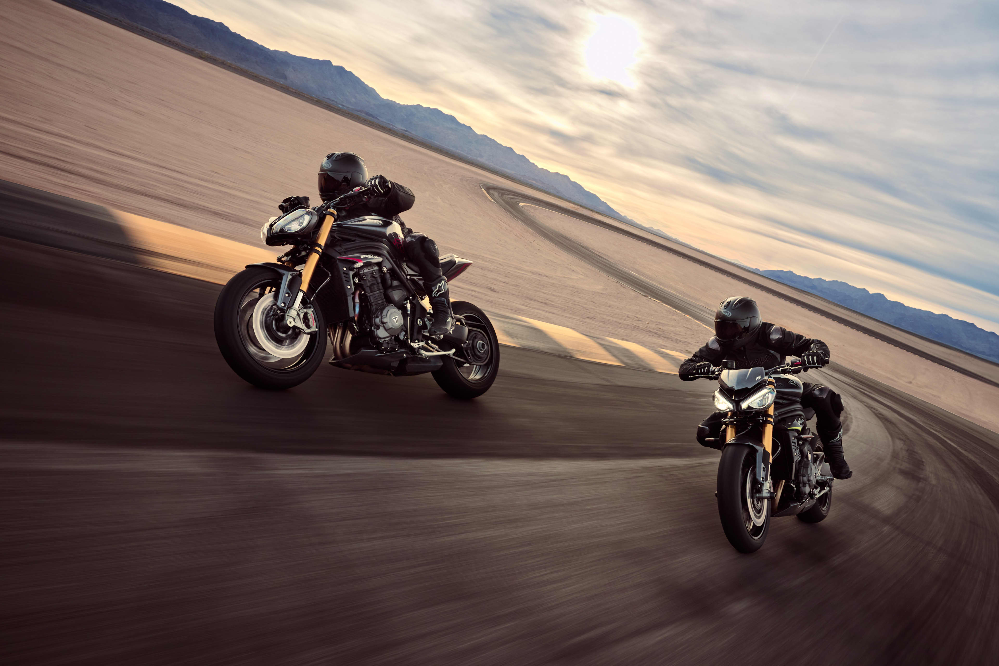 Two riders on the Speed Triple 1200 RS on the track