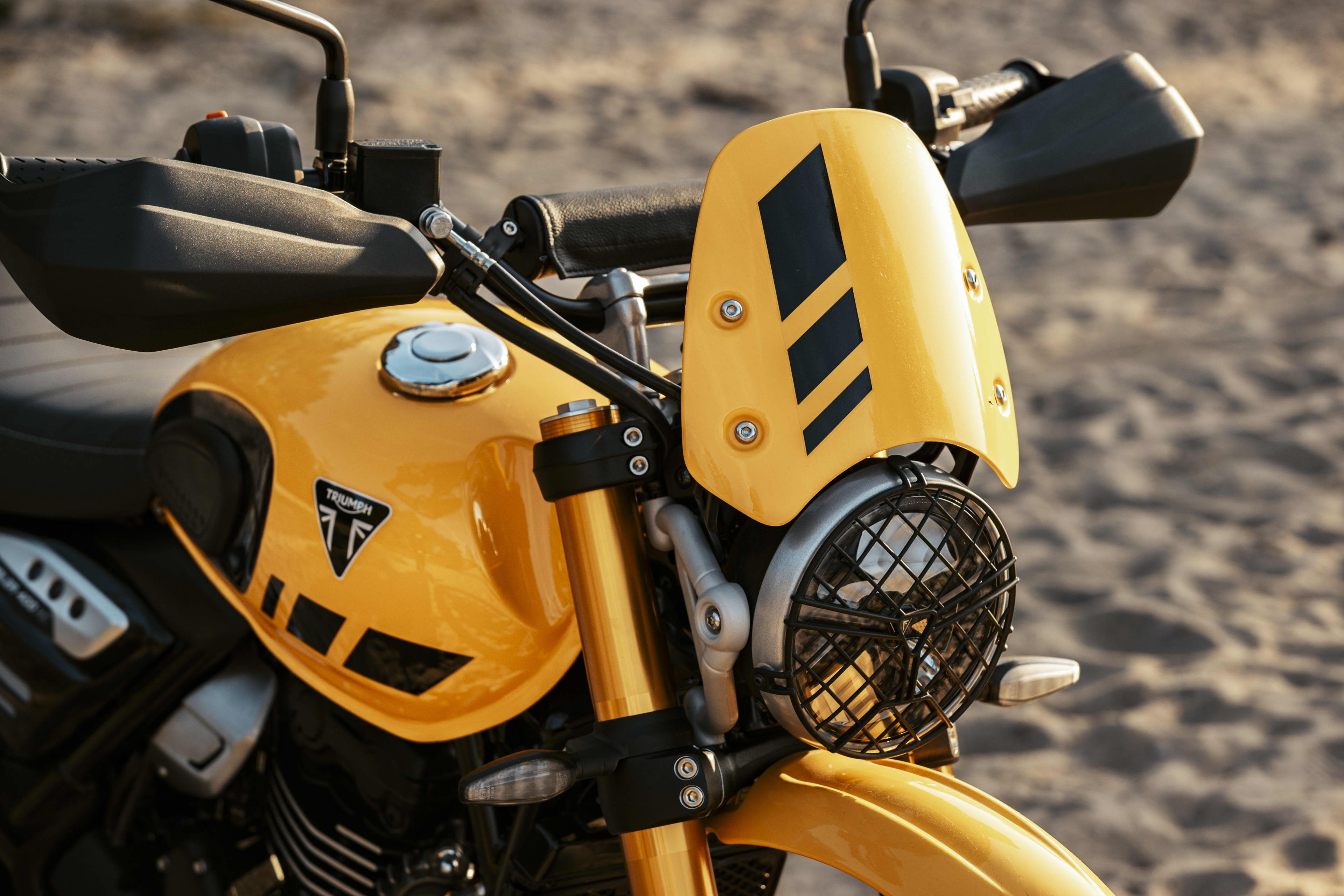 Scrambler 400 XC close up with headlight grille and flyscreen.