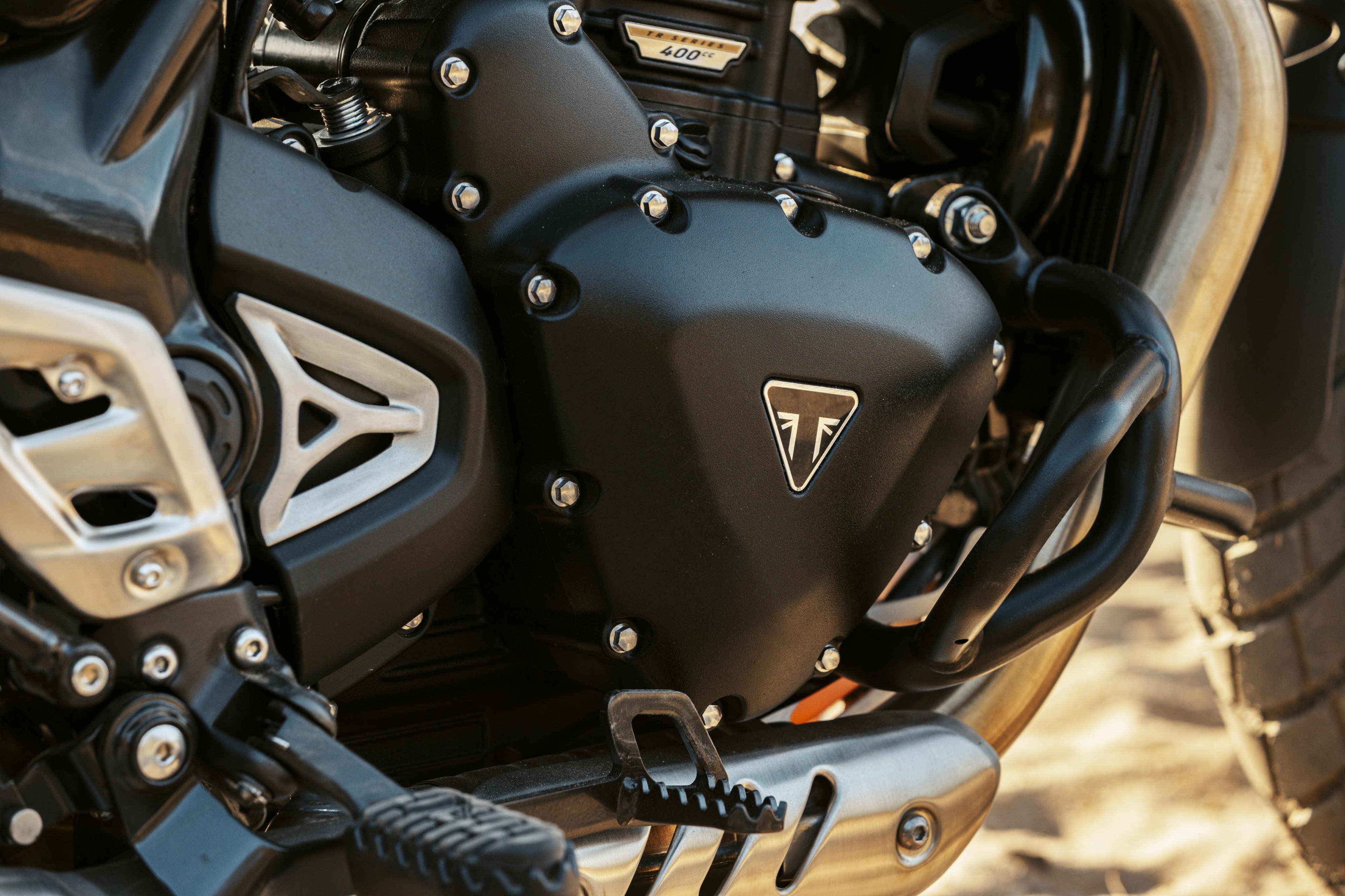 Scrambler 400 XC cover and triangle Triumph logo