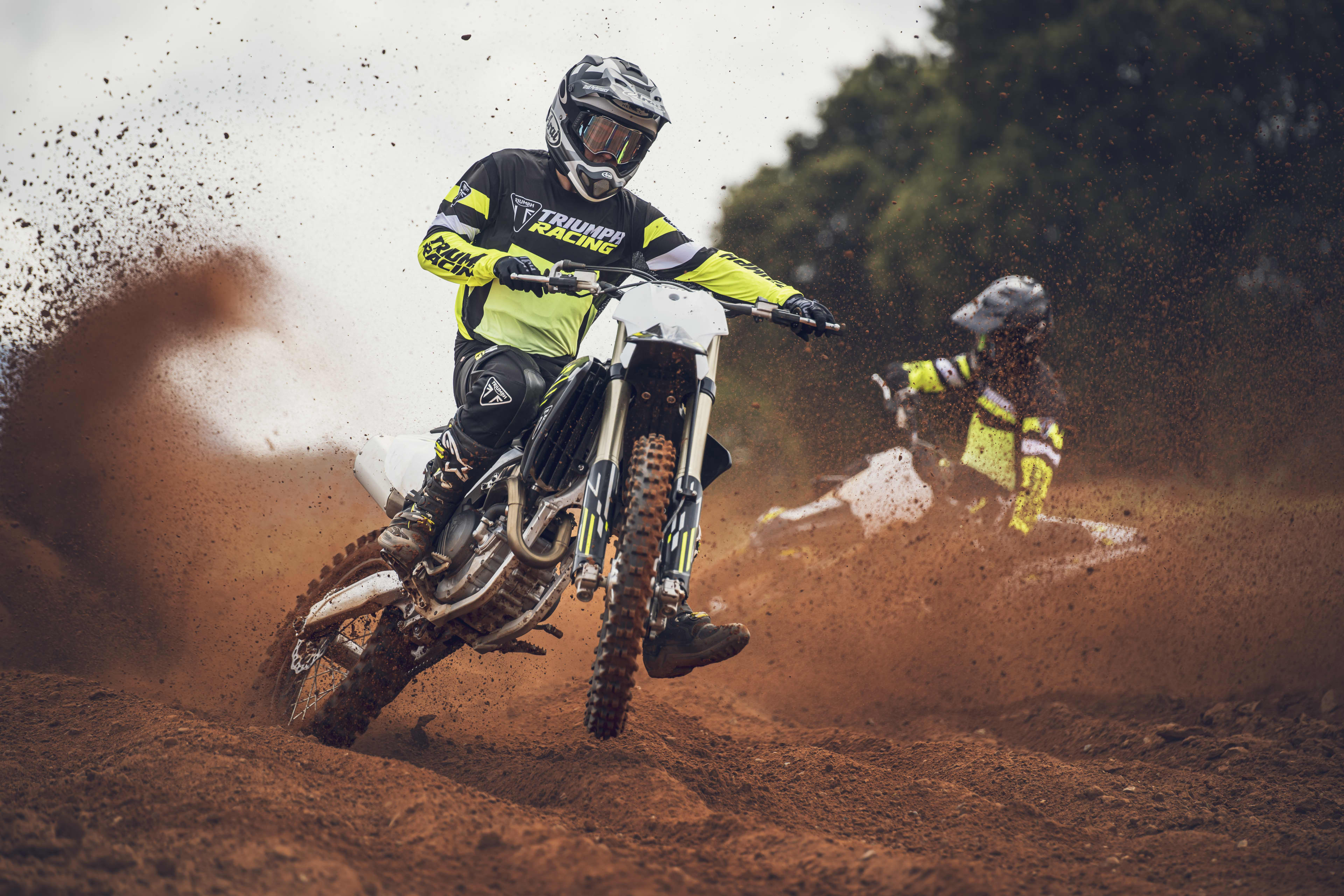 Rider on the TF 450-X riding through the dirt track