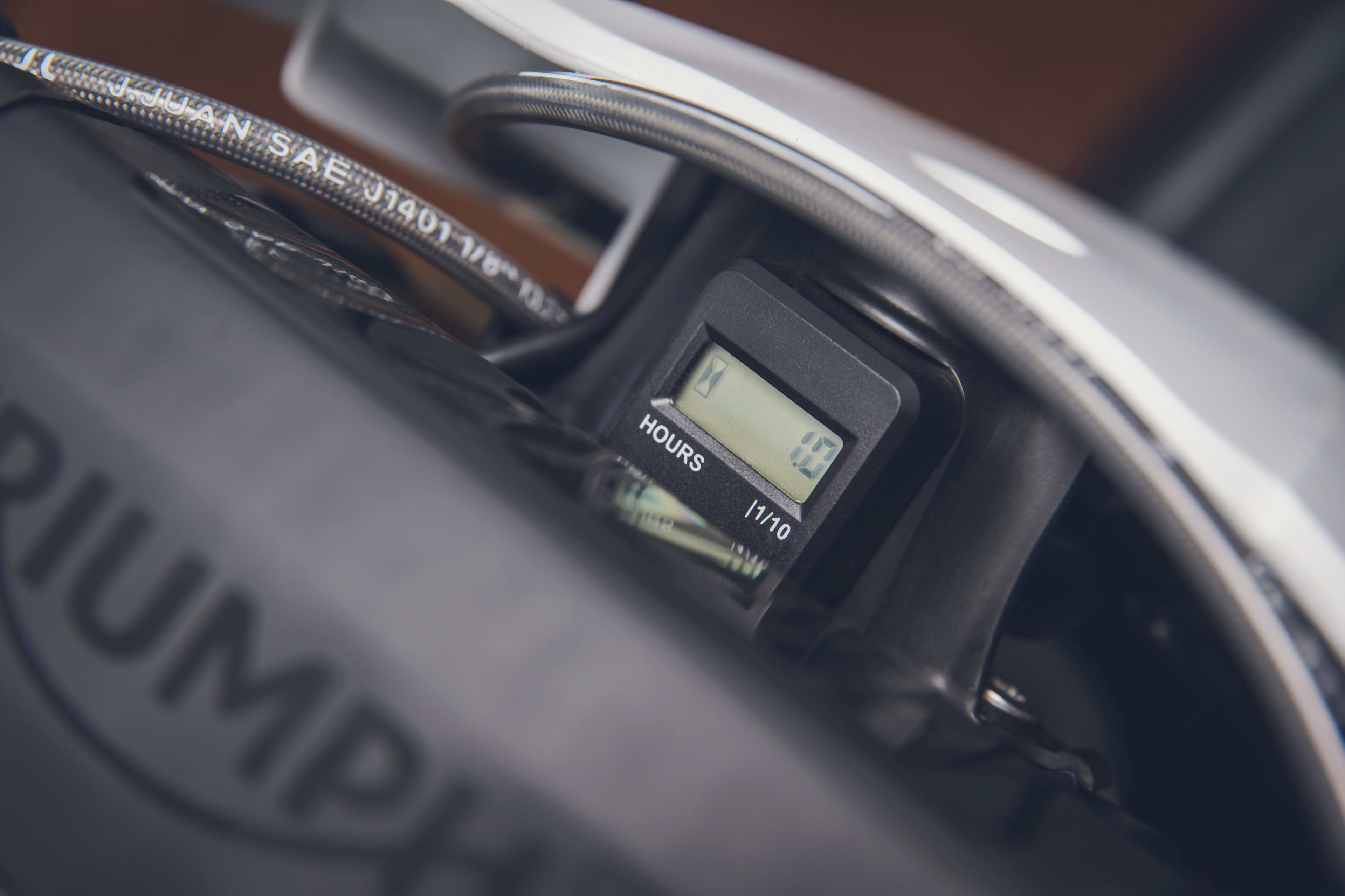 Triumph TF 250-X (MY26) discrete hour meter close up