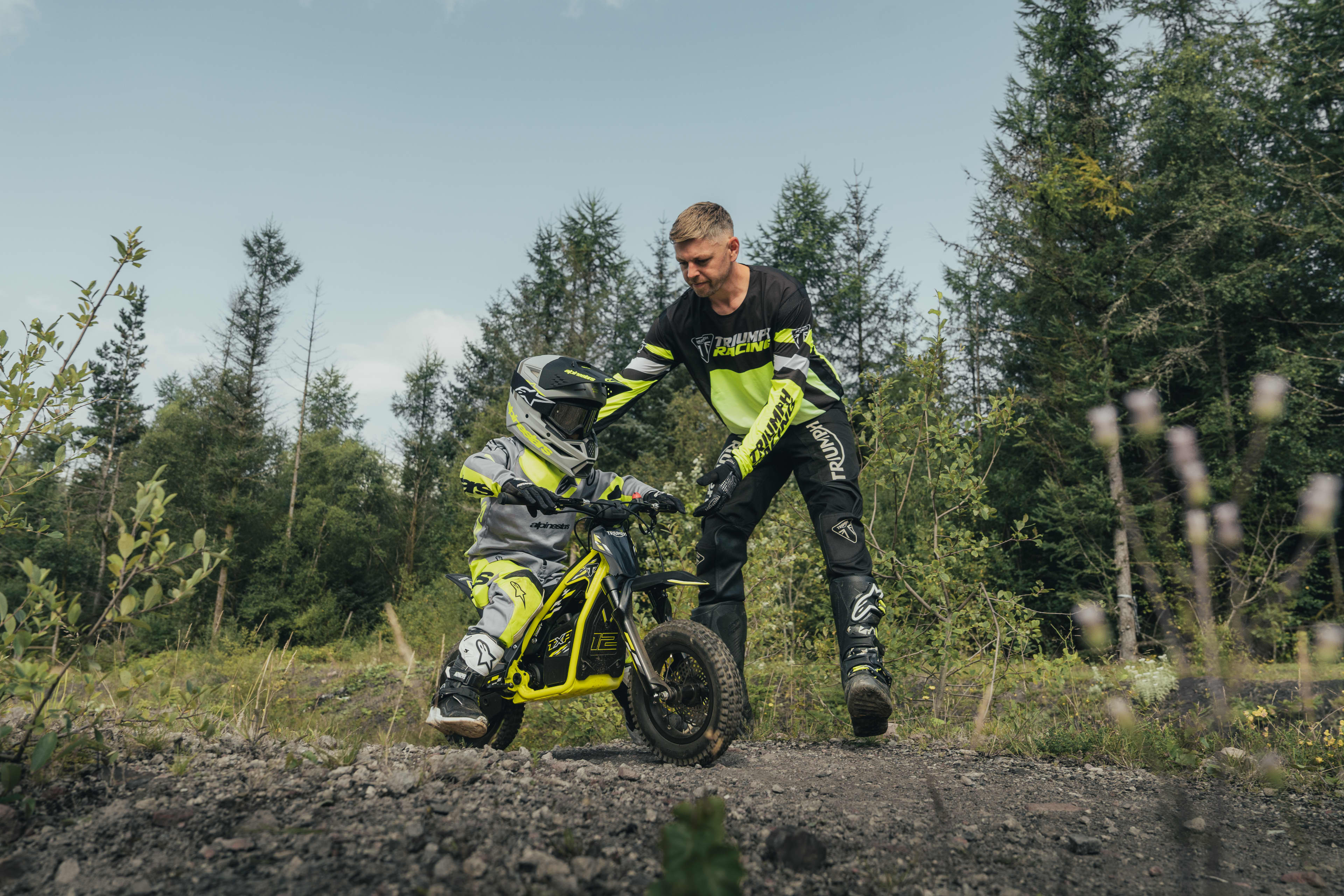 An adult showing the young rider the TXP-12 functionality.