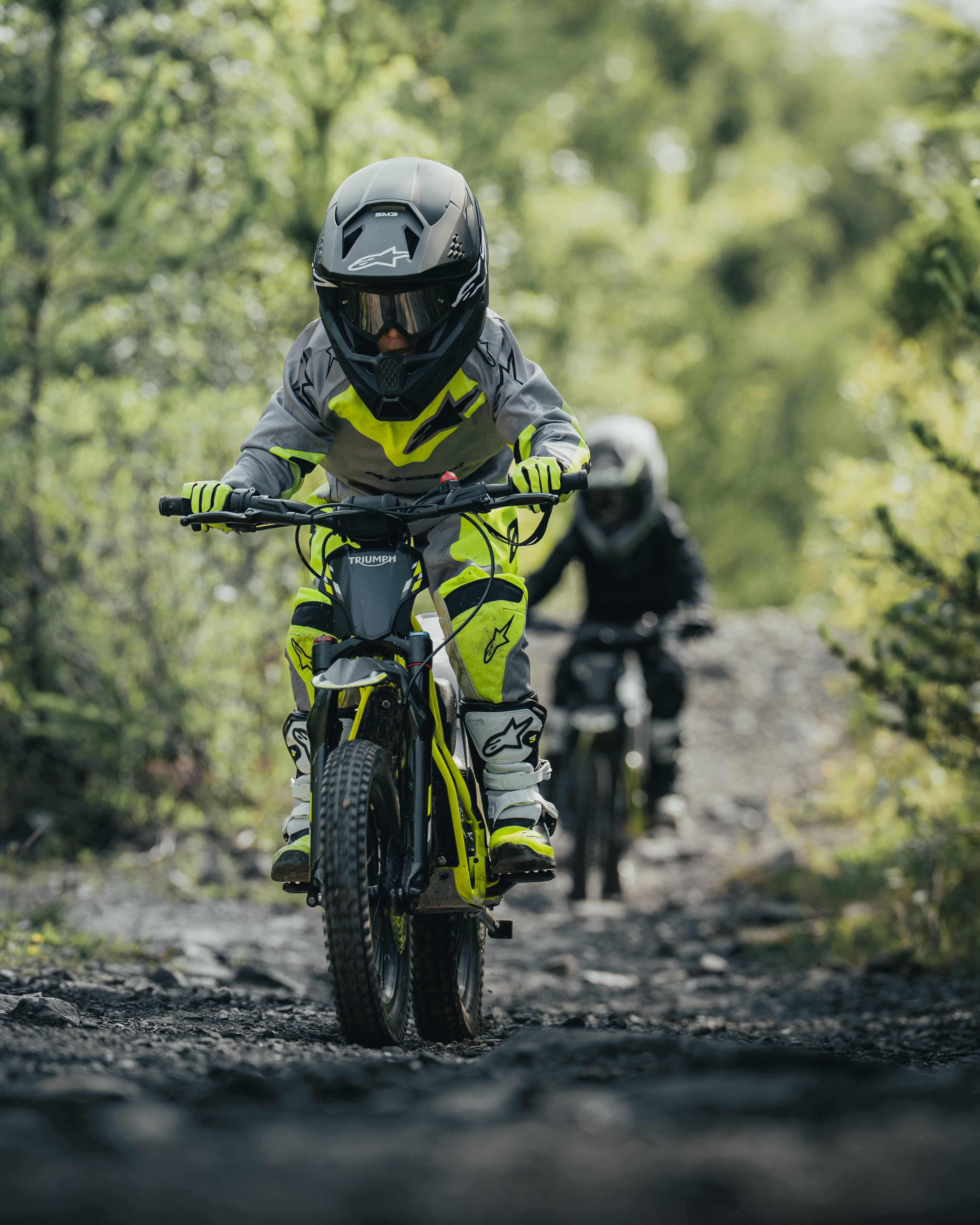 Young riders out exploring the forest on the Triumph TXP-16 powered by OSET bikes.