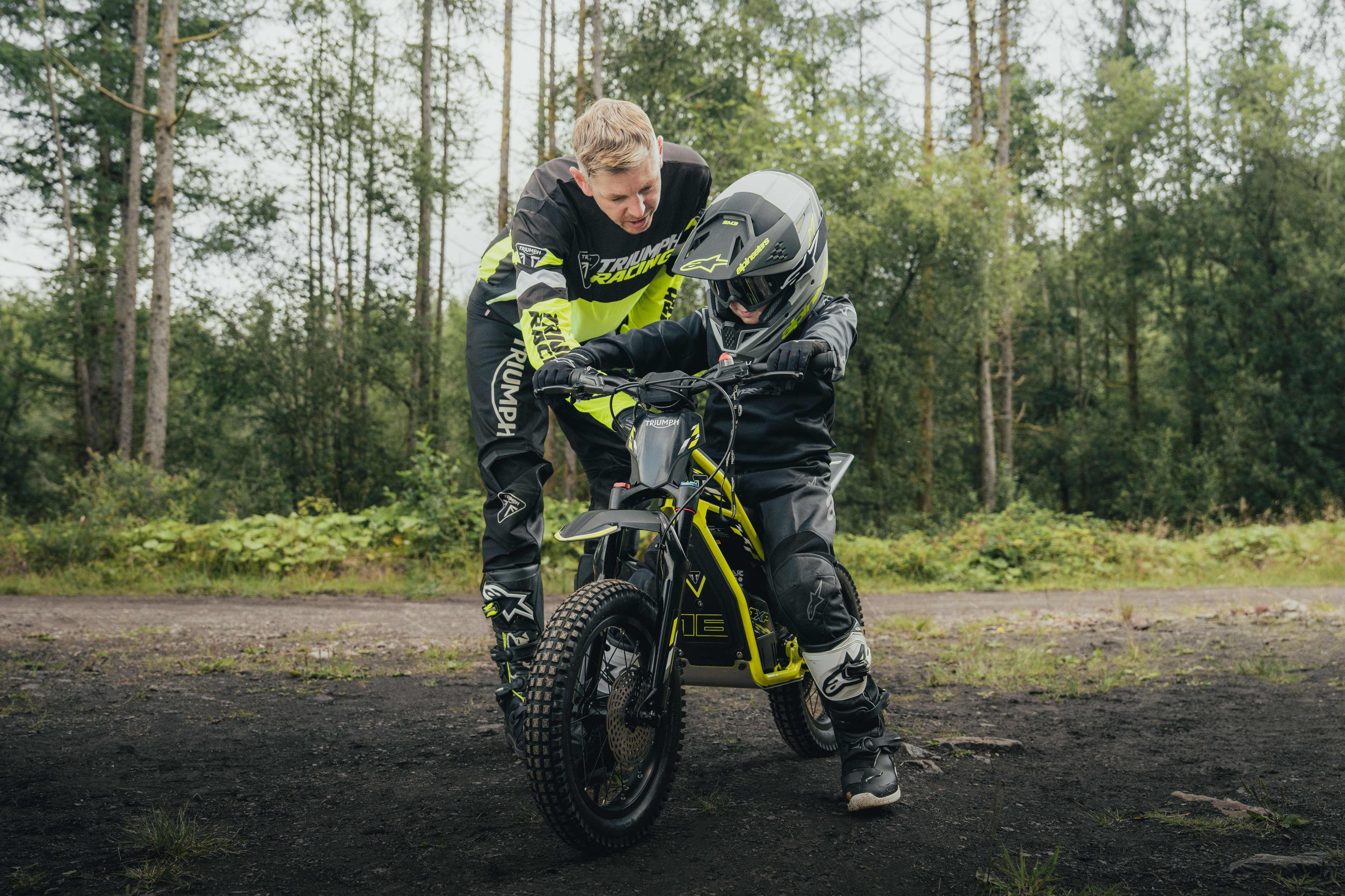 TXP-16 electric bike with a young rider on it; practicing with an adult rider.