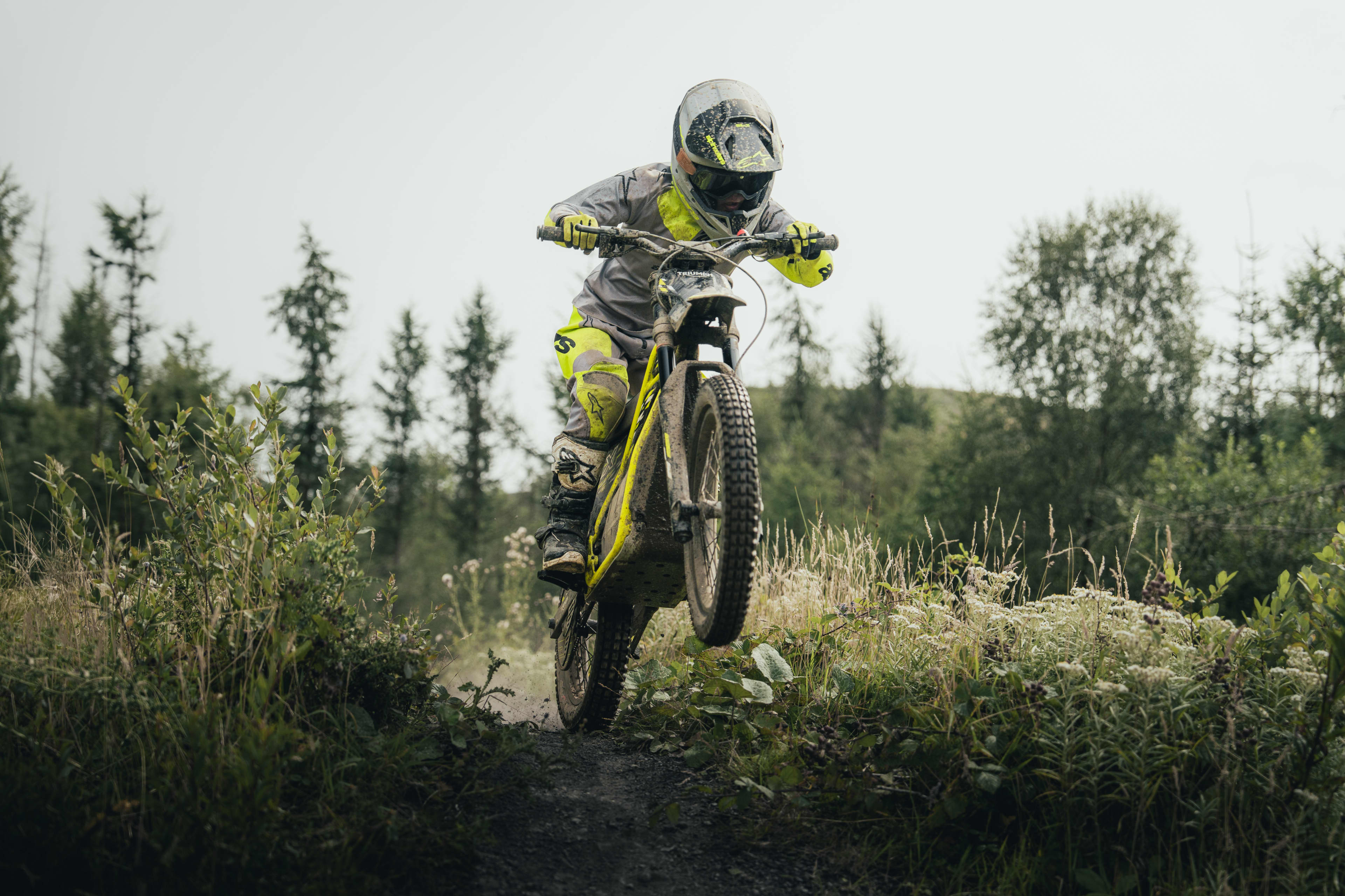 Triumph TXP-20 powered by OSET bike on a forest trail.