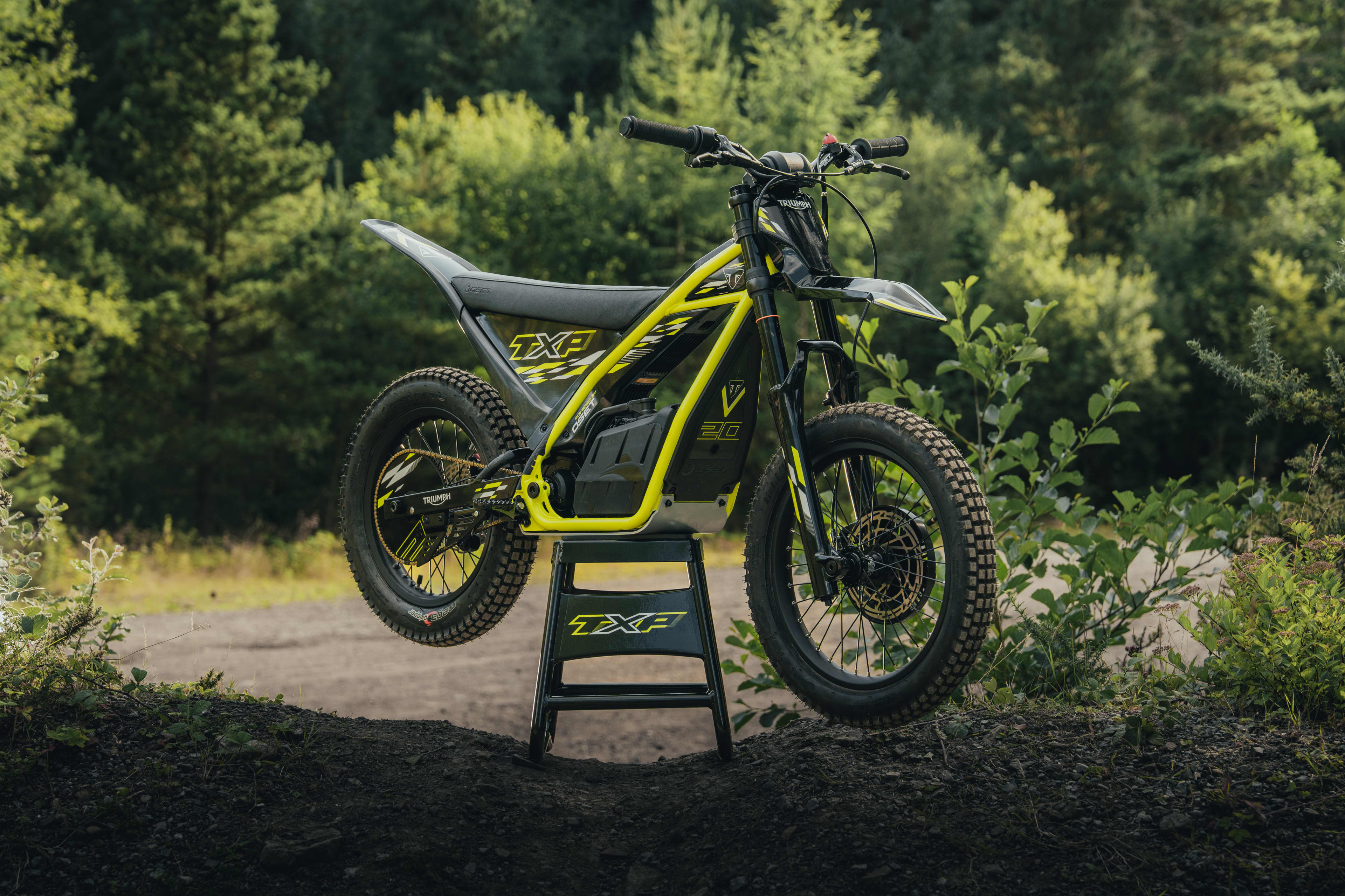 TXP-20 powered by OSET parked up on the stand with the forest setting.