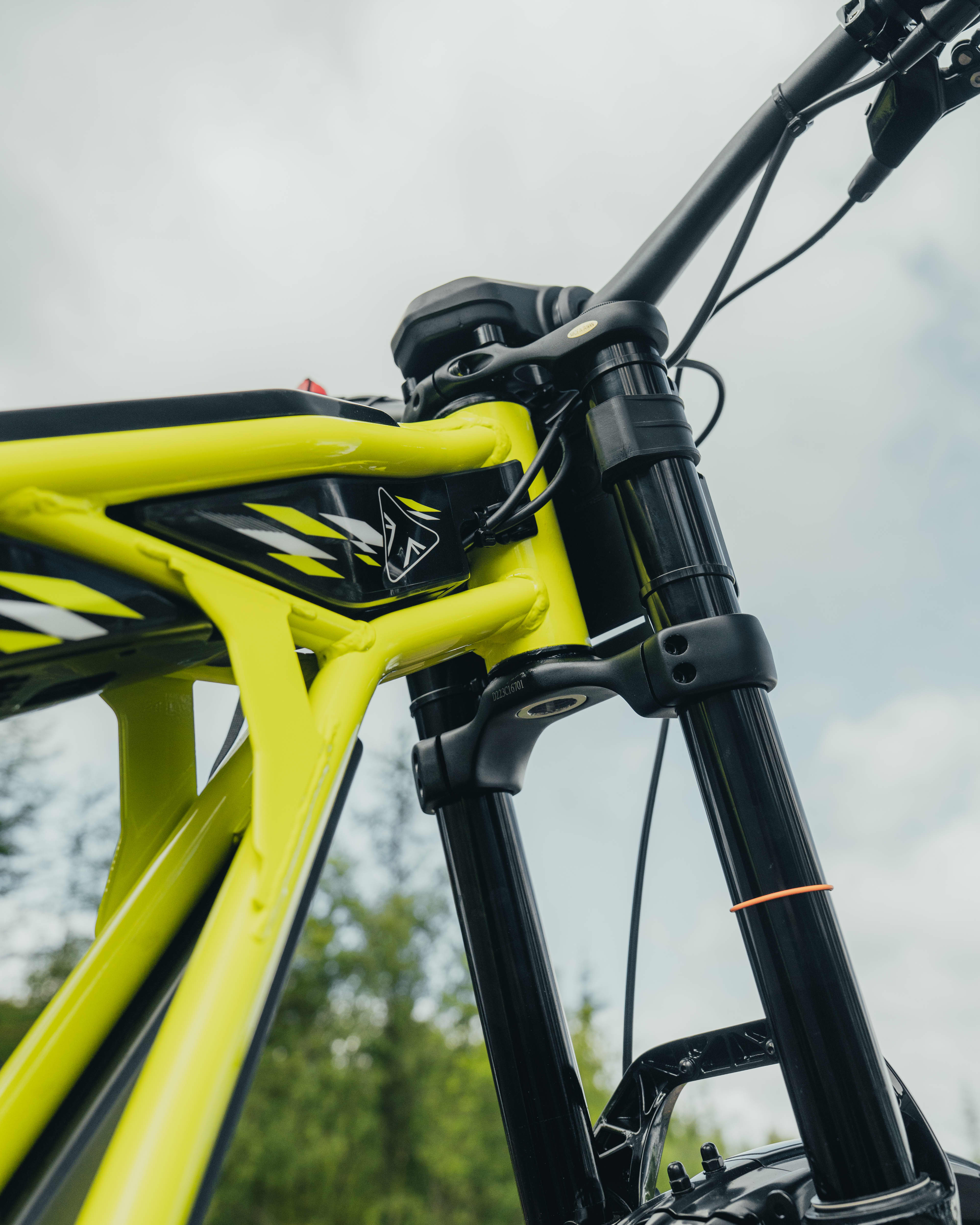 Triumph TXP-24 performance yellow livery on the electric bike.