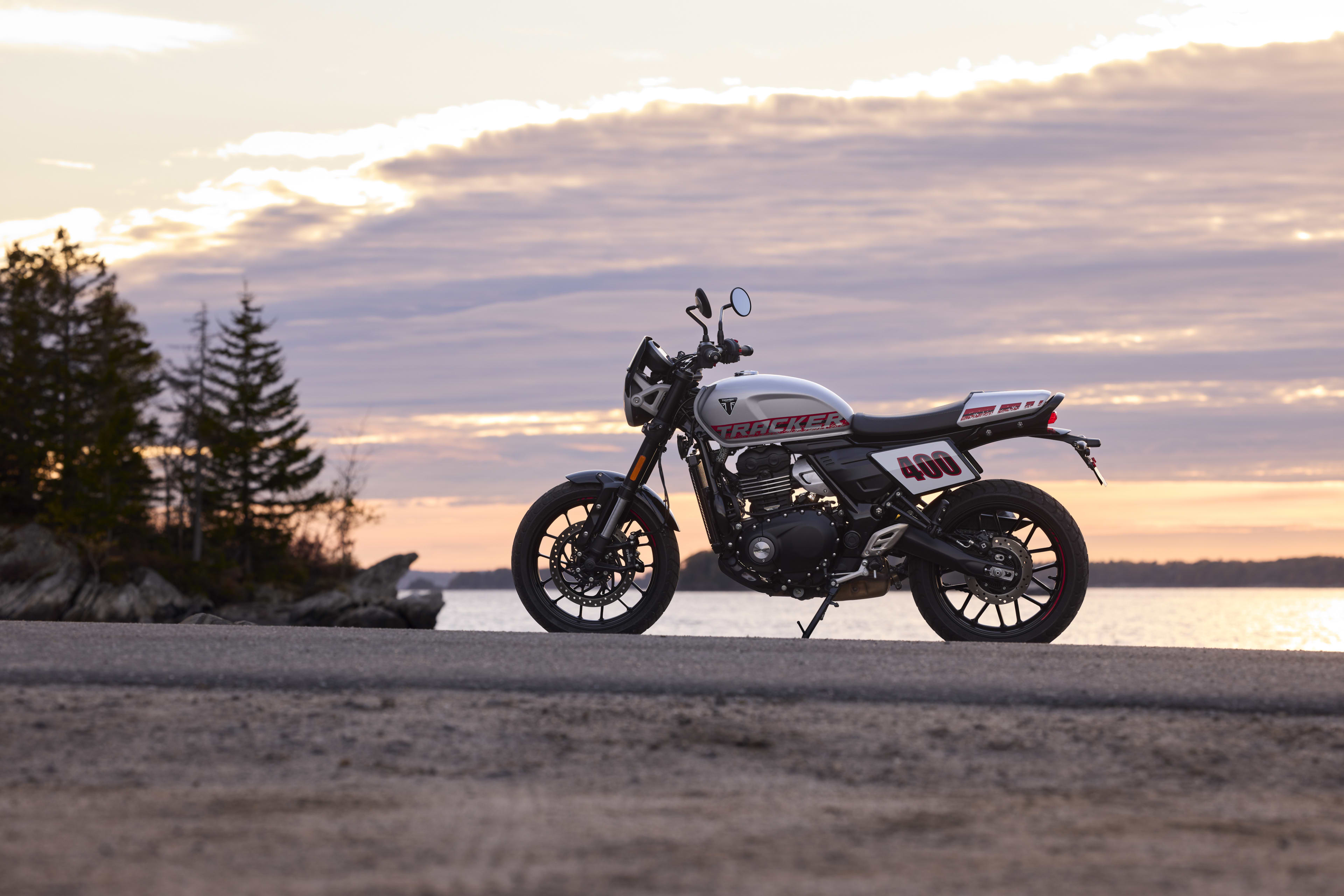 Right side view of Tracker 400 parked on rocky road 