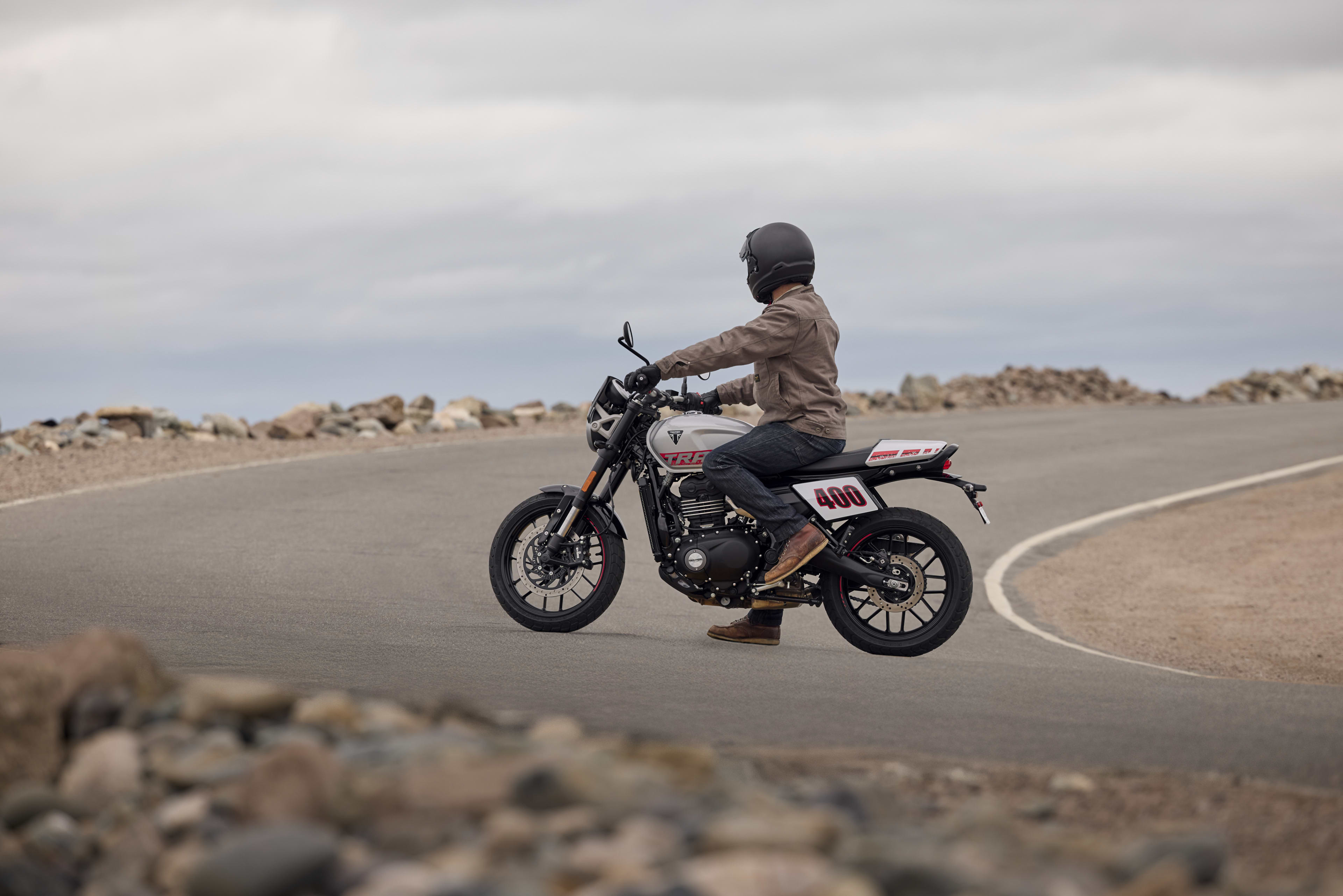 Rider on a parked Tracker 400 in the middle of the road