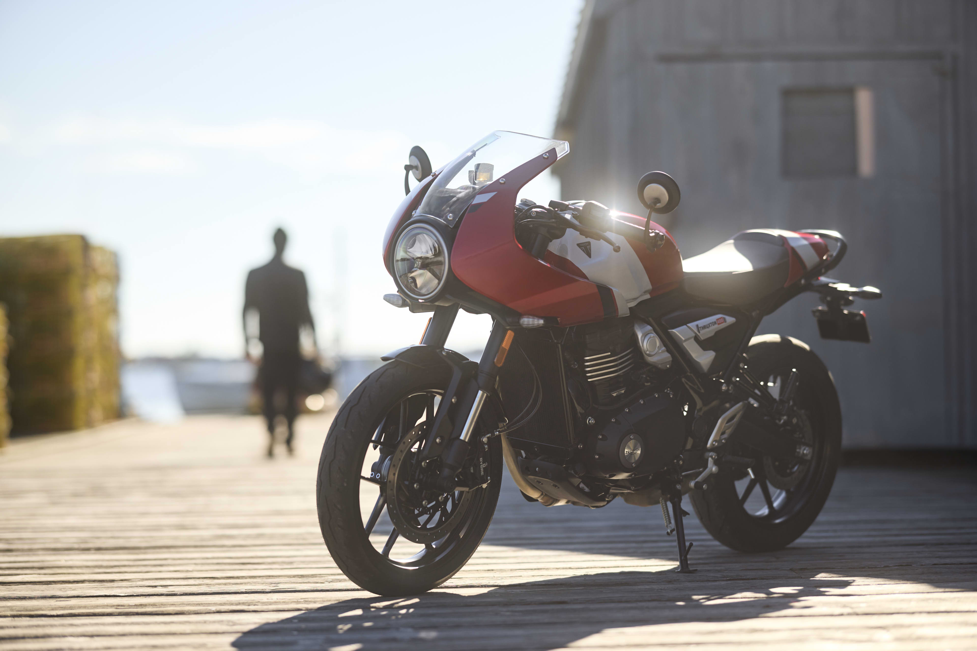 Left hand side of Thruxton 400 in Carnival red and Aluminium silver