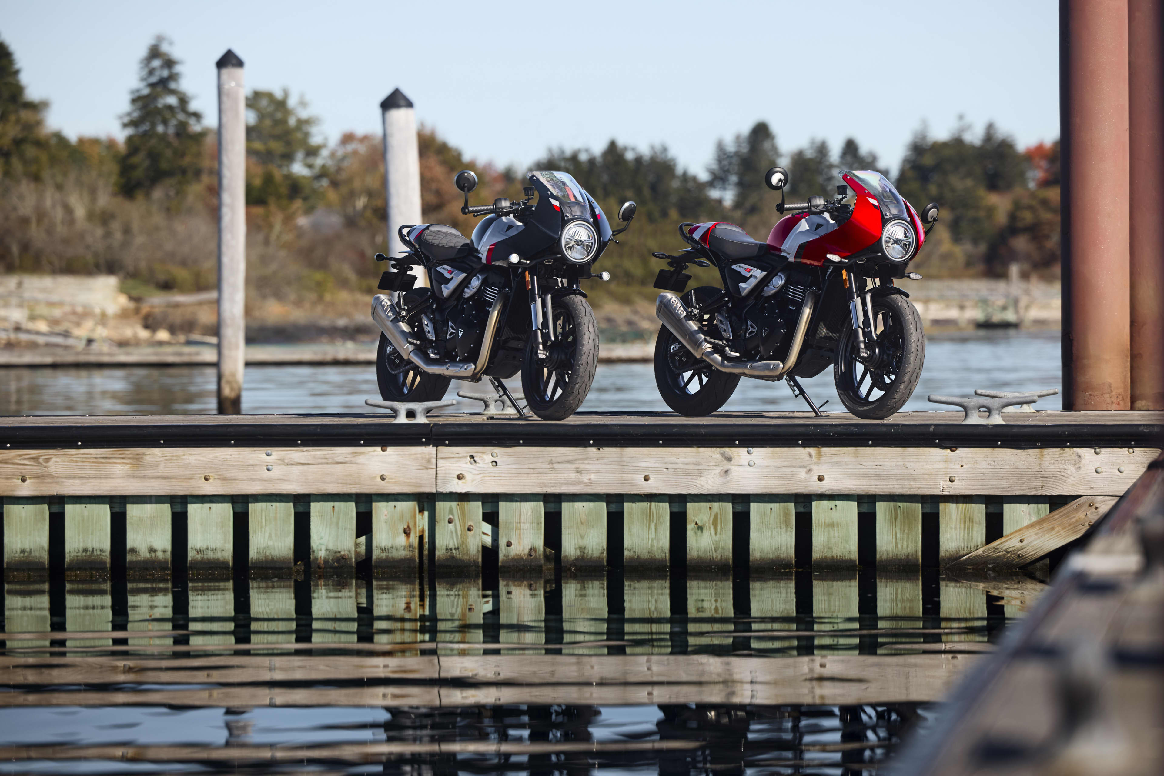 Thruxton 400 parked on dock with a sea background