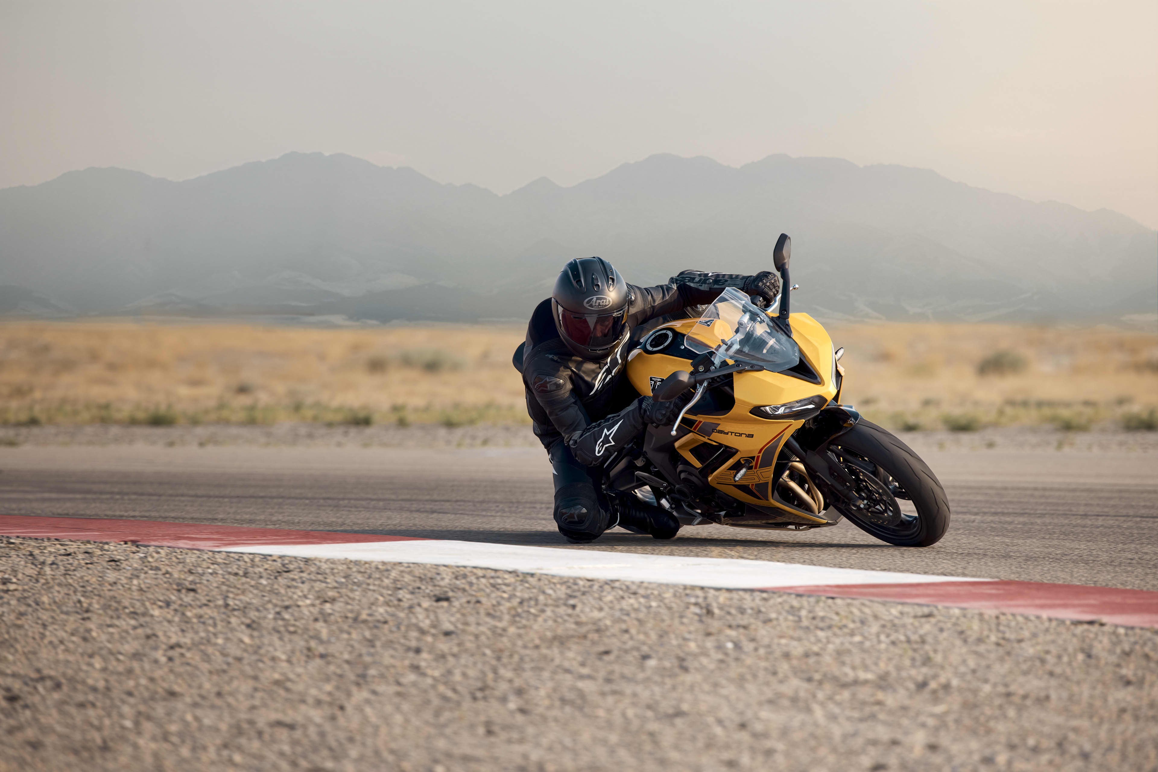 Angled side view of Triumph Daytona 660 in Cosmic yellow