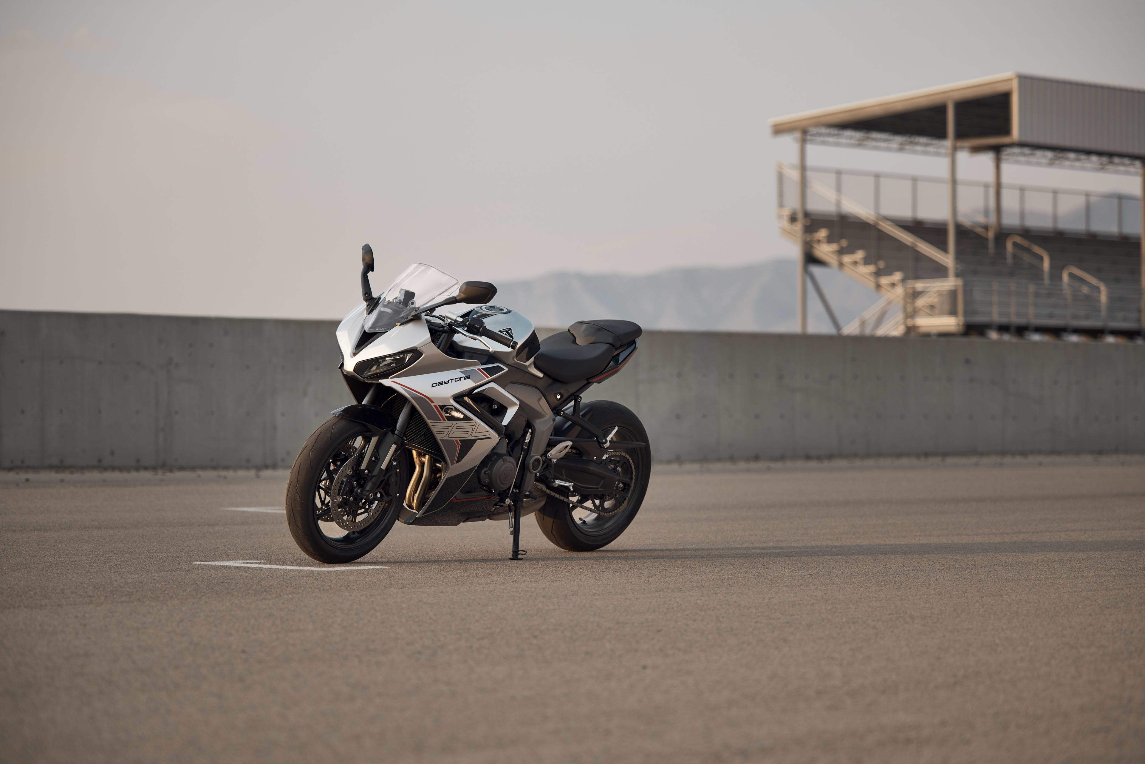 Angled left side shot of stationary Triumph Daytona 660 in Aluminium silver