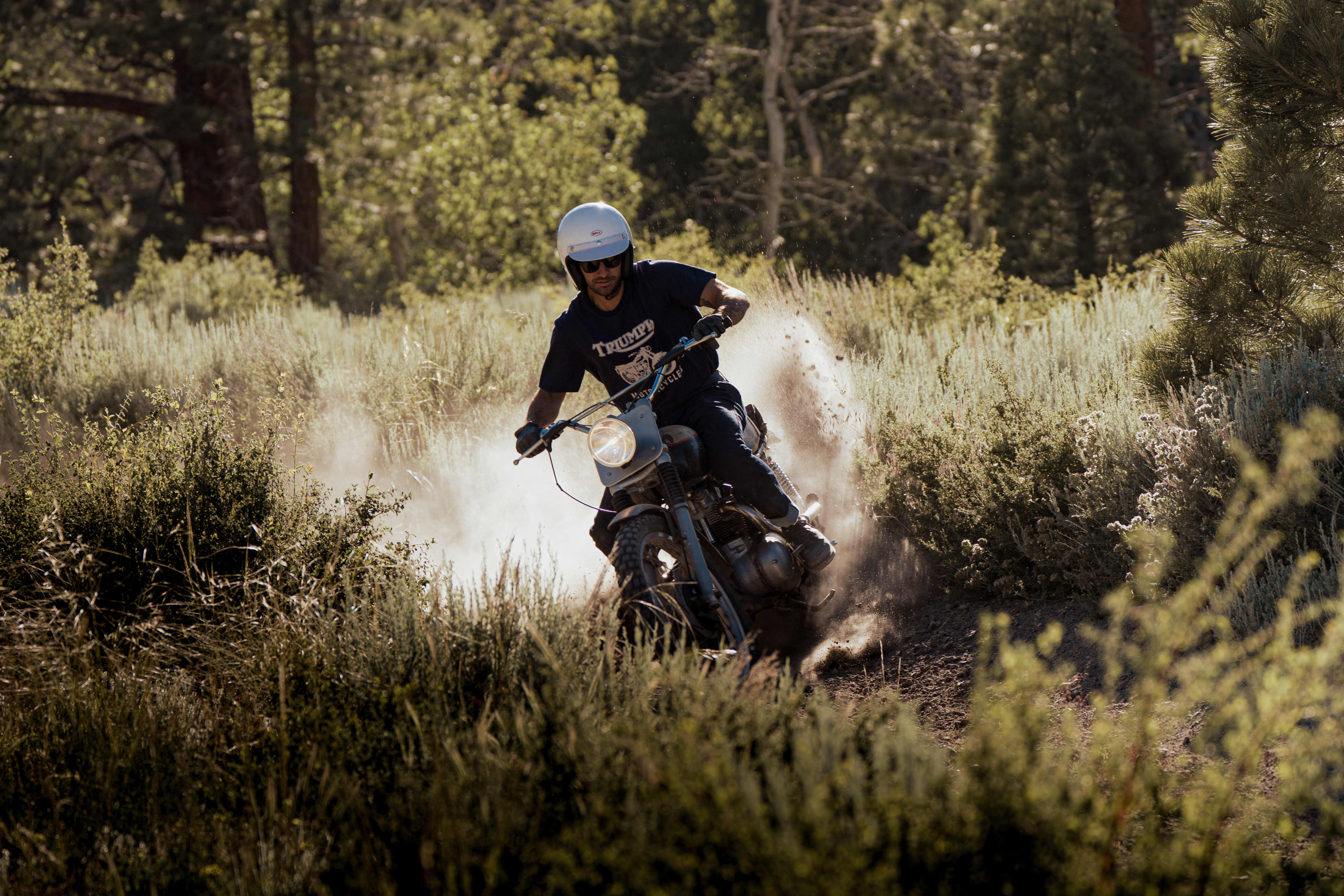Man riding a Triumph Motorcycle wearing Triumph Heritage Clothing