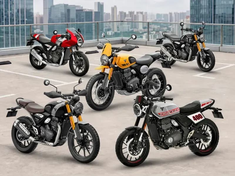 A lineup of five Triumph 400cc motorcycles, featuring a mix of modern classics, cafe racers, and scrambler styles, parked on an outdoor rooftop parking lot with a city skyline backdrop.