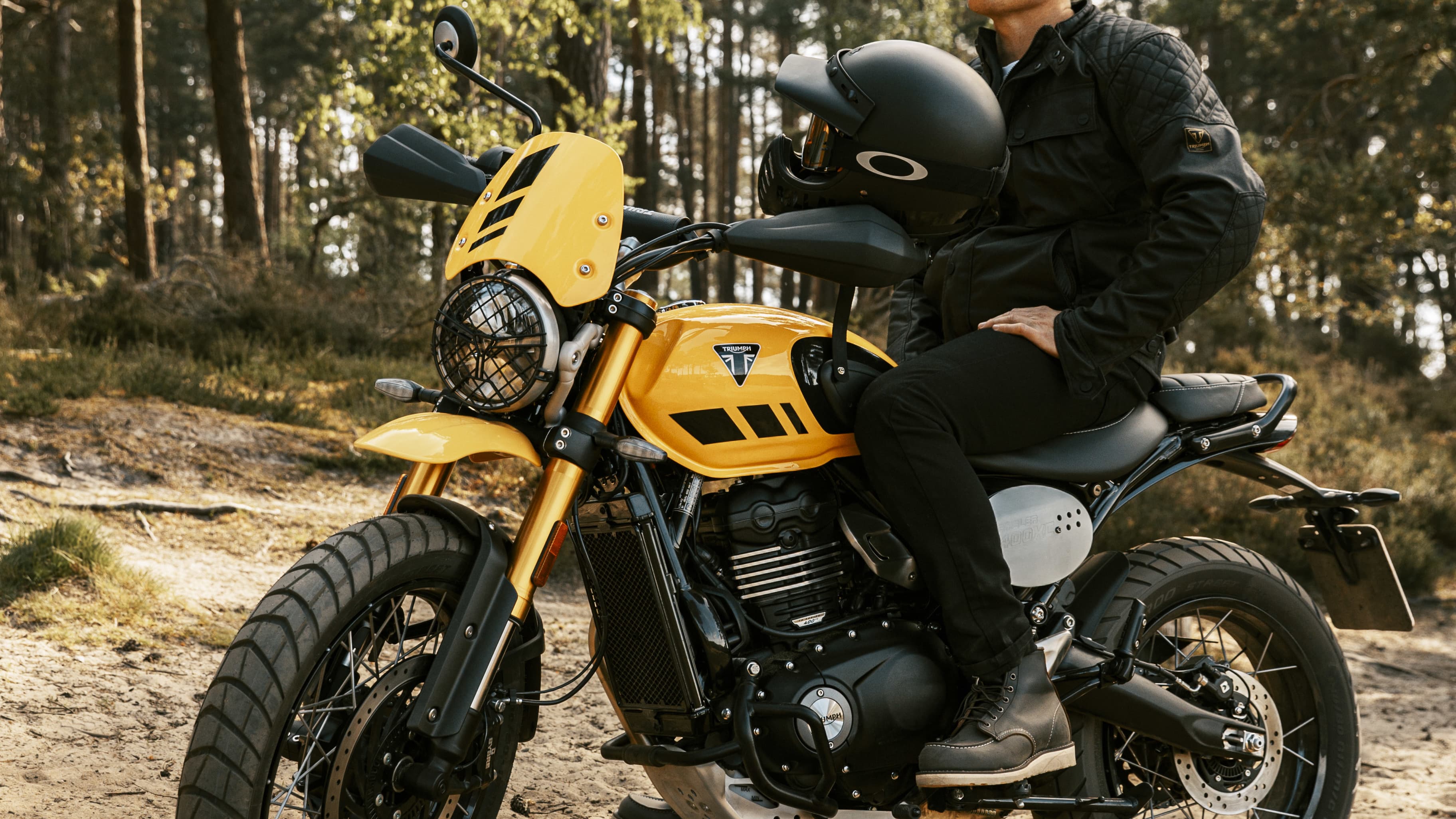 Triumph Scrambler 400 XC with rider 