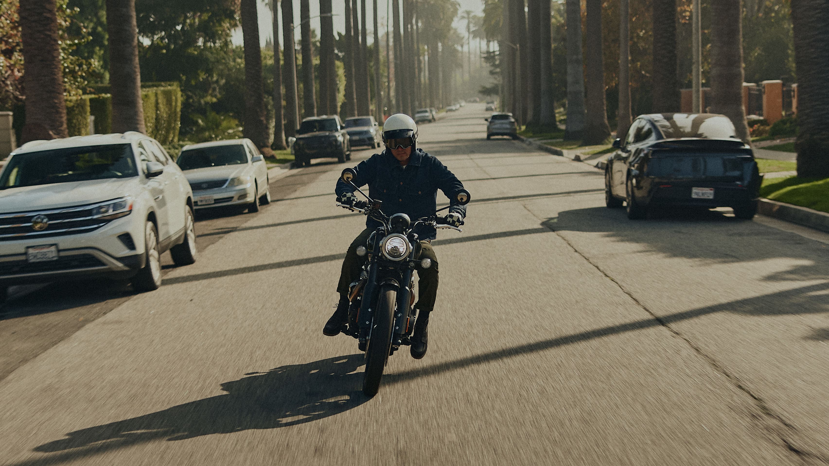Man riding on Triumph Motorbike wearing Triumph Jacket
