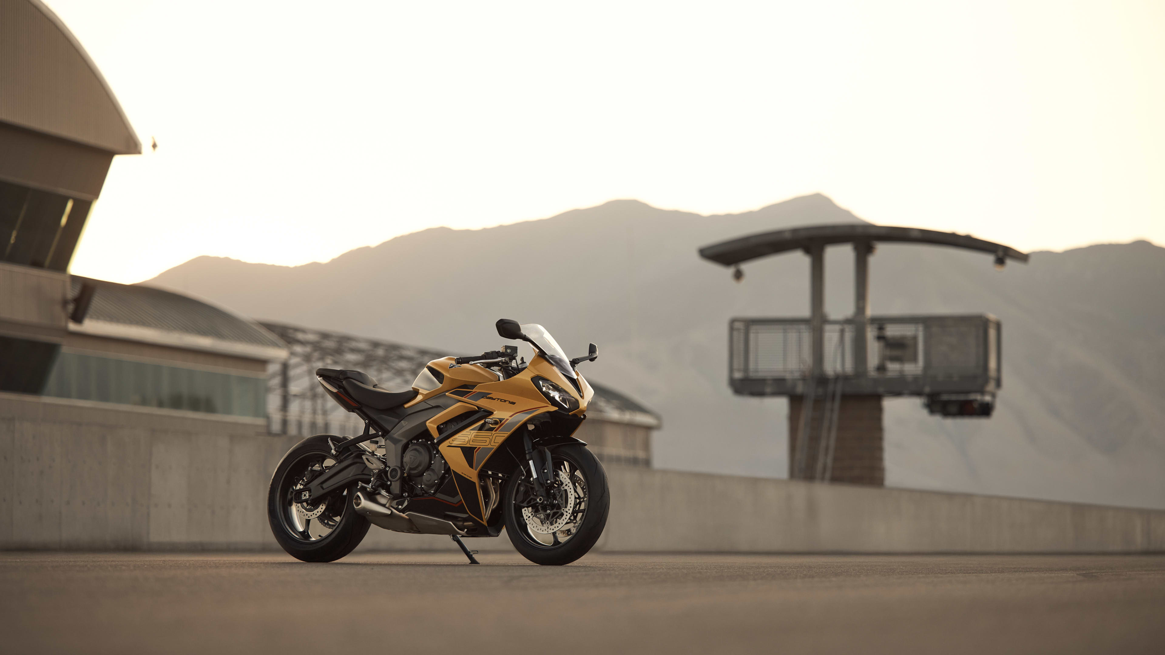 Right side shot of stationary Triumph Daytona 660 in Cosmic yellow