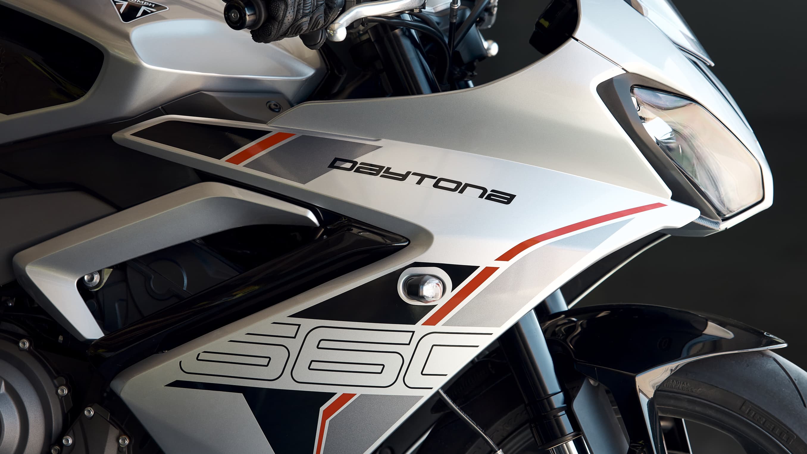 Close up of the front ride side of The Triumph Daytona 660 in Aluminium silver