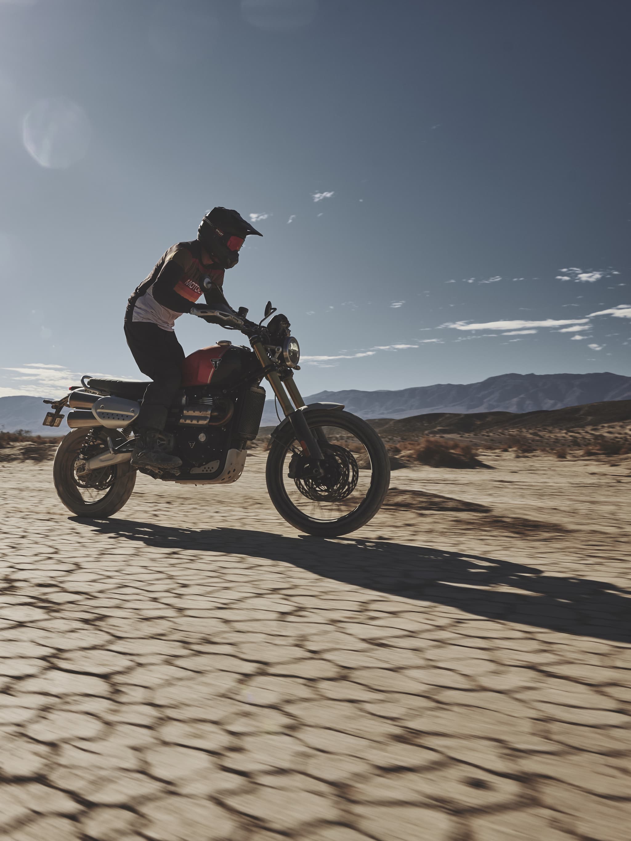 SCRAMBLER Scrambler 1200 XE with rider on sand.