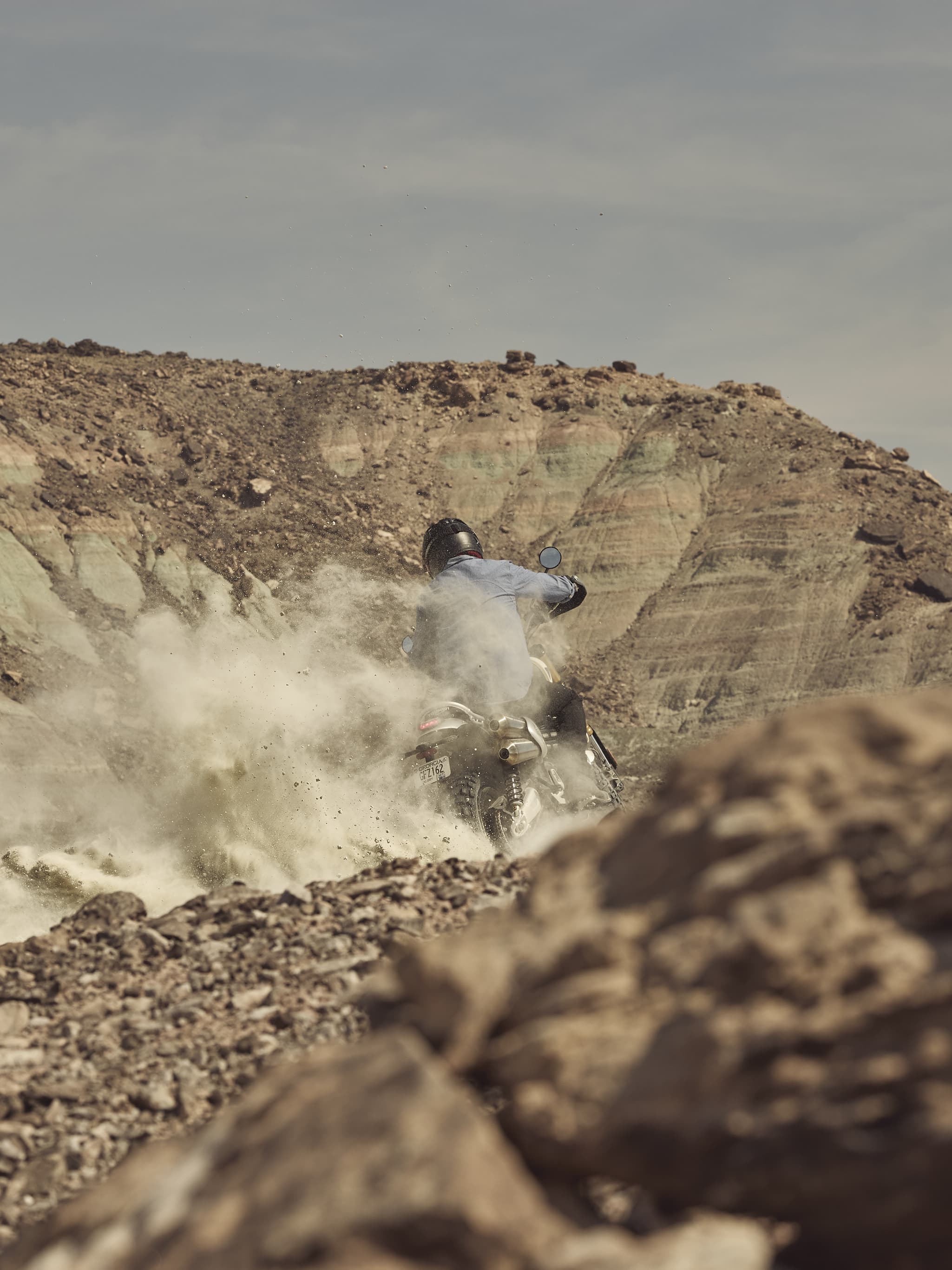 Scrambler 1200 XE with rider on sand.