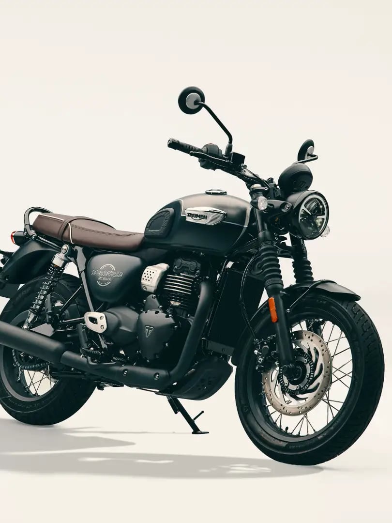Nouvelle Bonneville T40 Black Studio shot of a satin grey and black Triumph Bonneville T40 Black motorcycle parked on a light background.