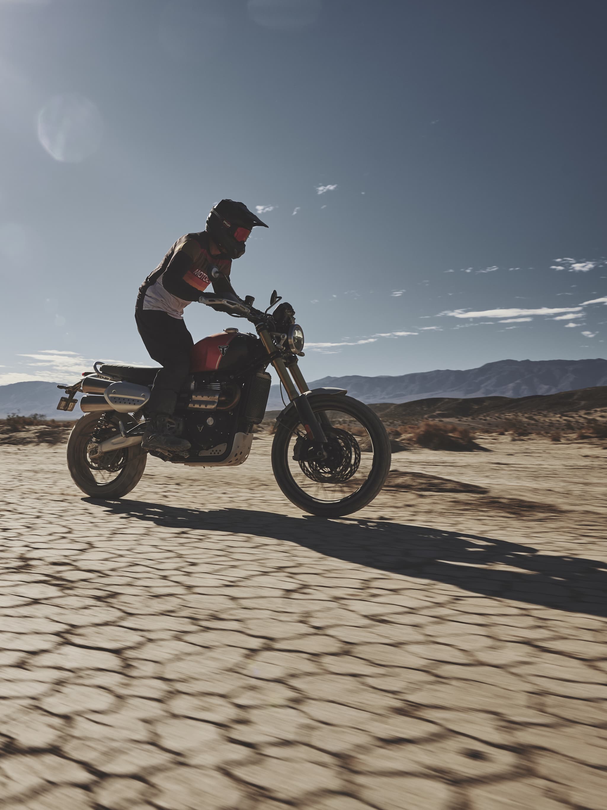 Scrambler 1200 XE with rider on sand.