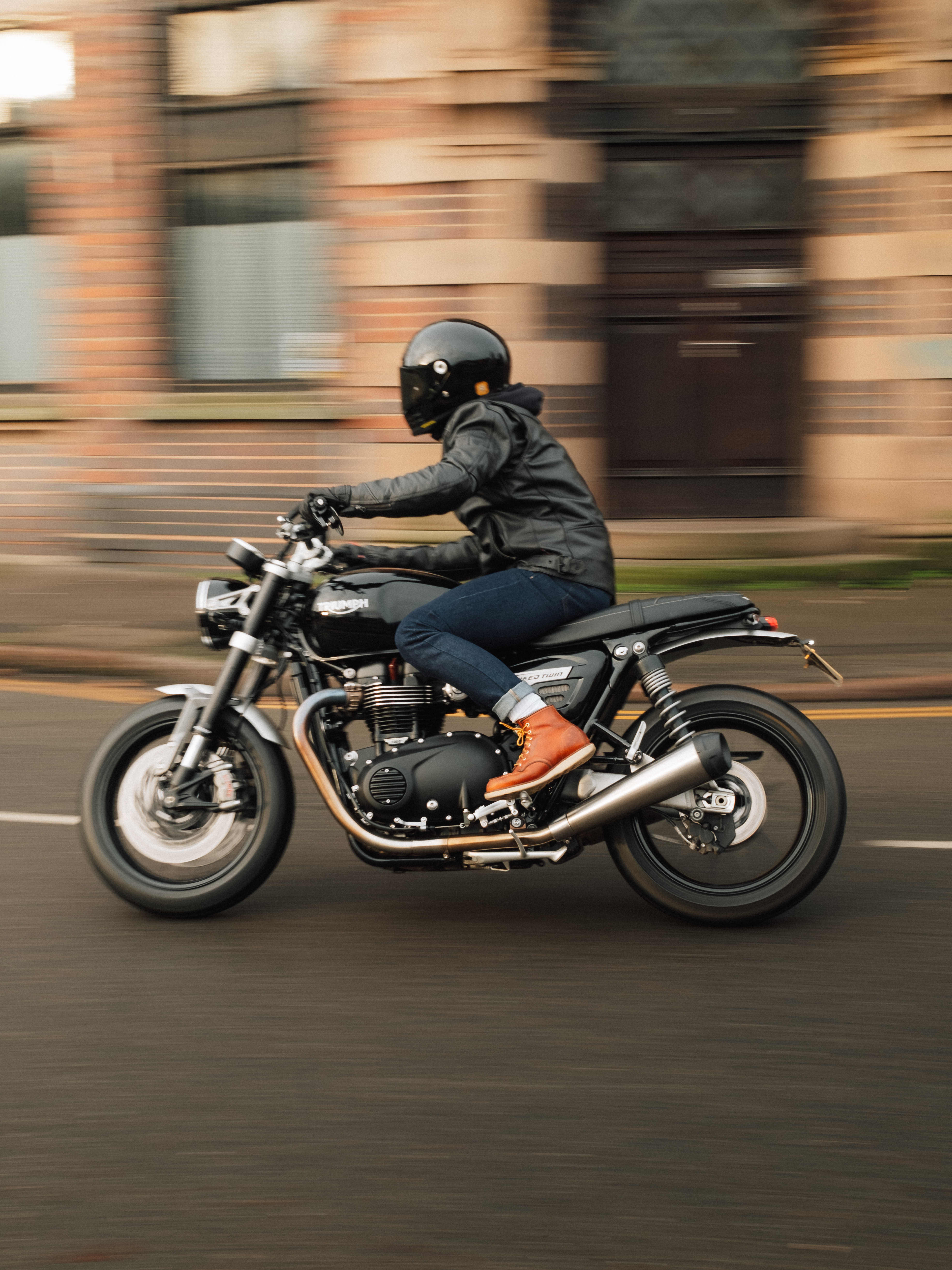 Man riding a Triumph Motorcycle wearing Armalith Jeans