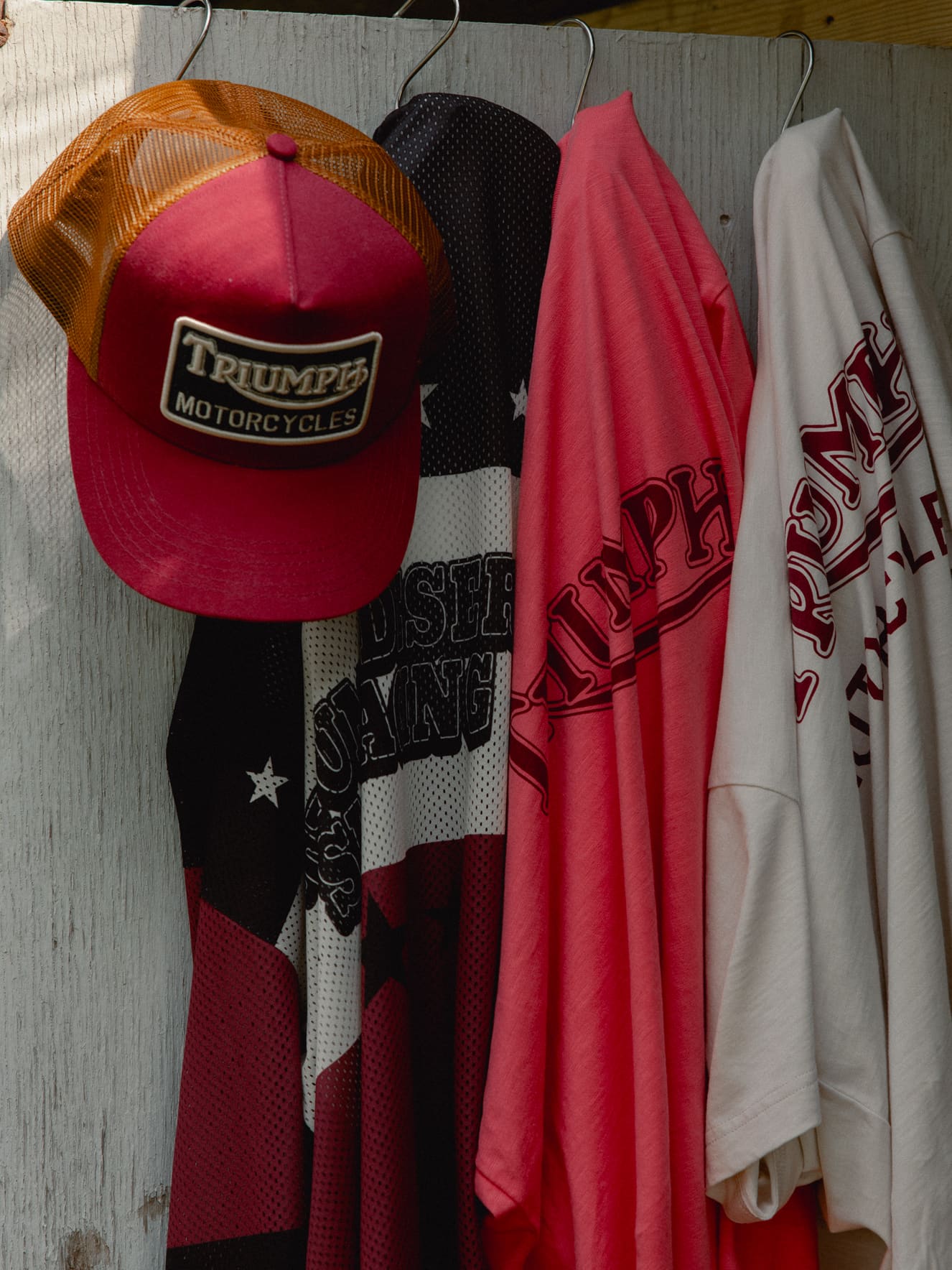 Triumph Heritage Clothing hanging on a door