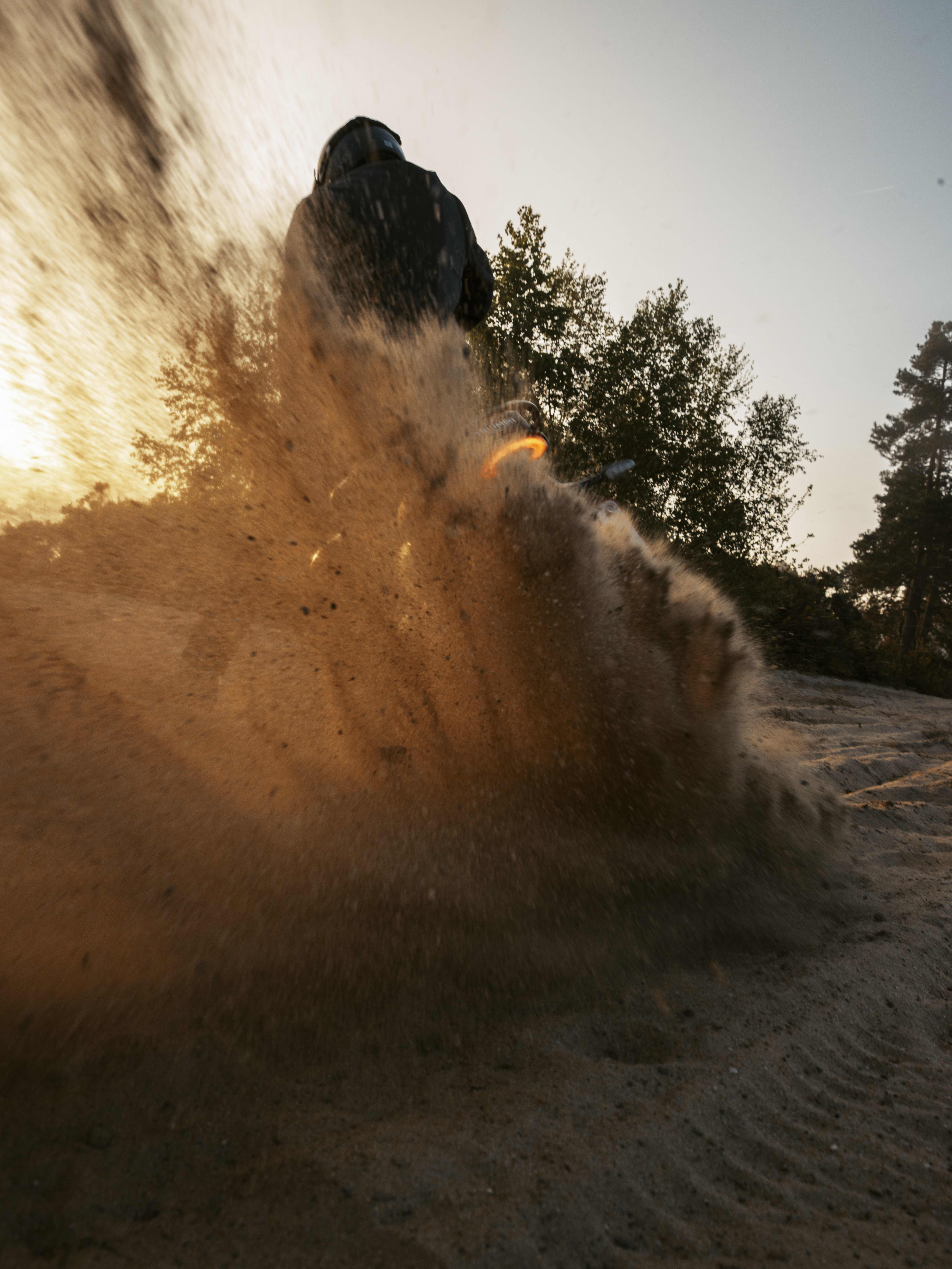 Scrambler 400 XC riding through sand 