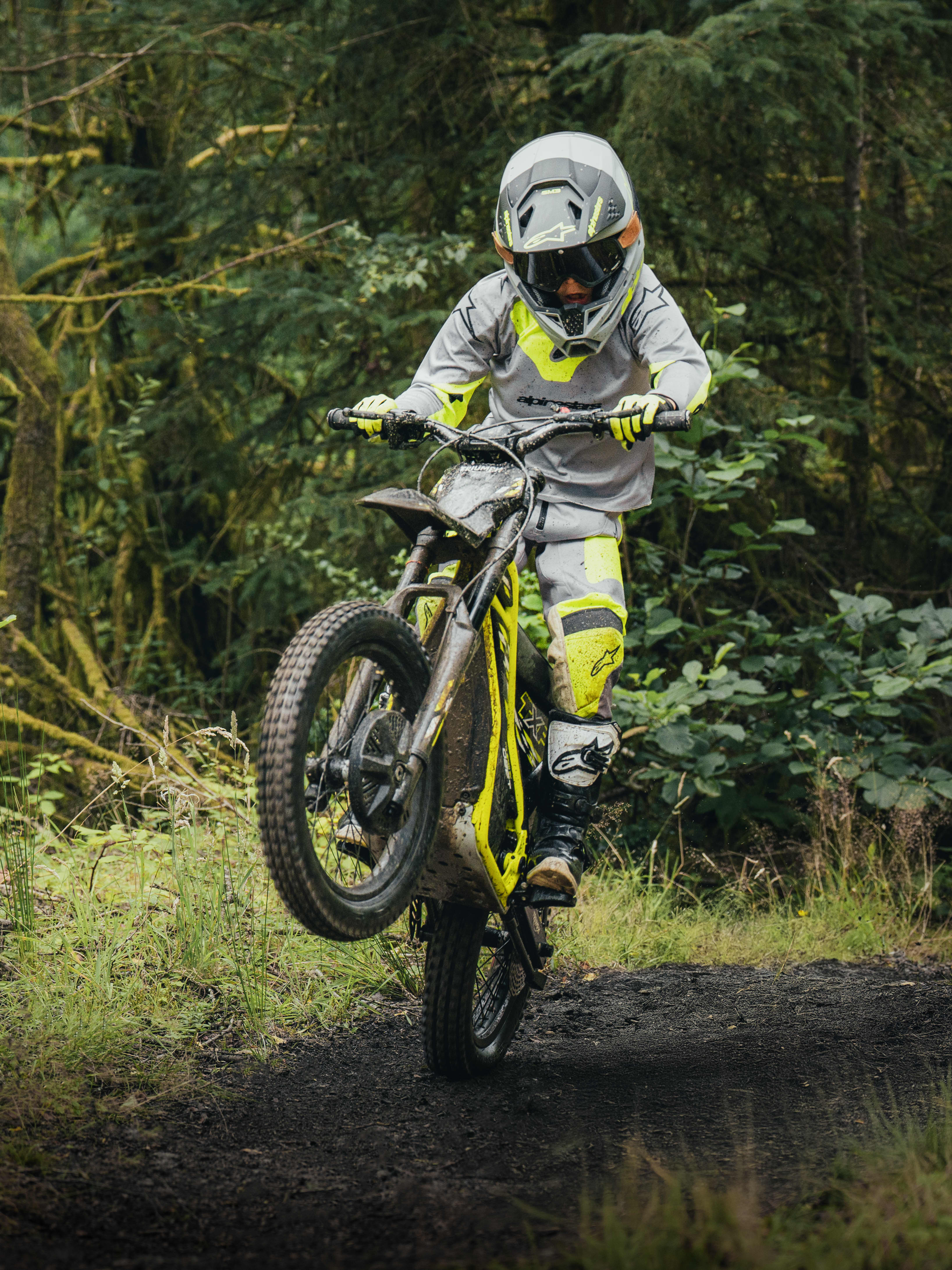TXP-20 powered by OSET with a young rider on a forest trail.