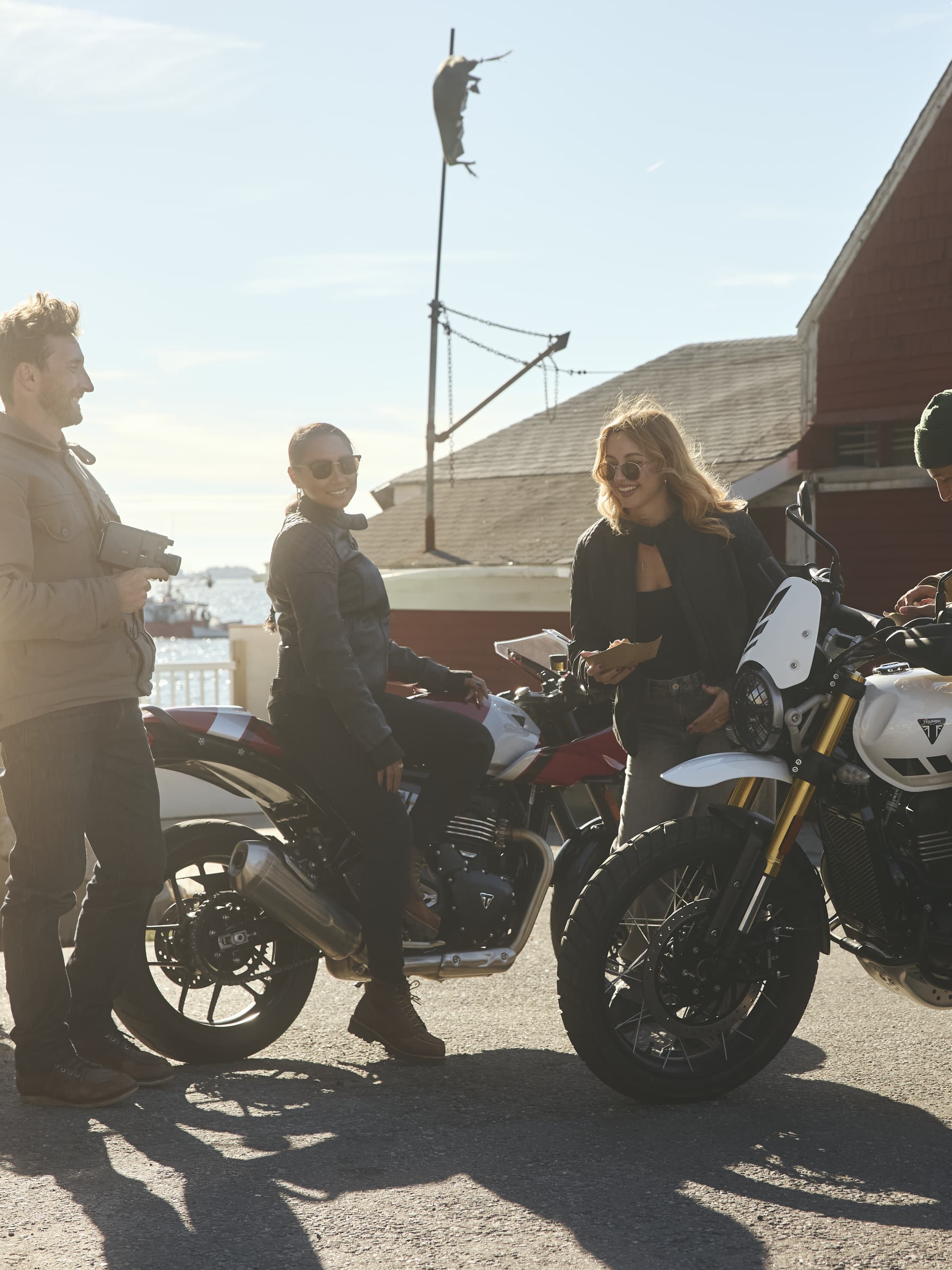 Riders surrounding Triumph 400cc Modern Classics