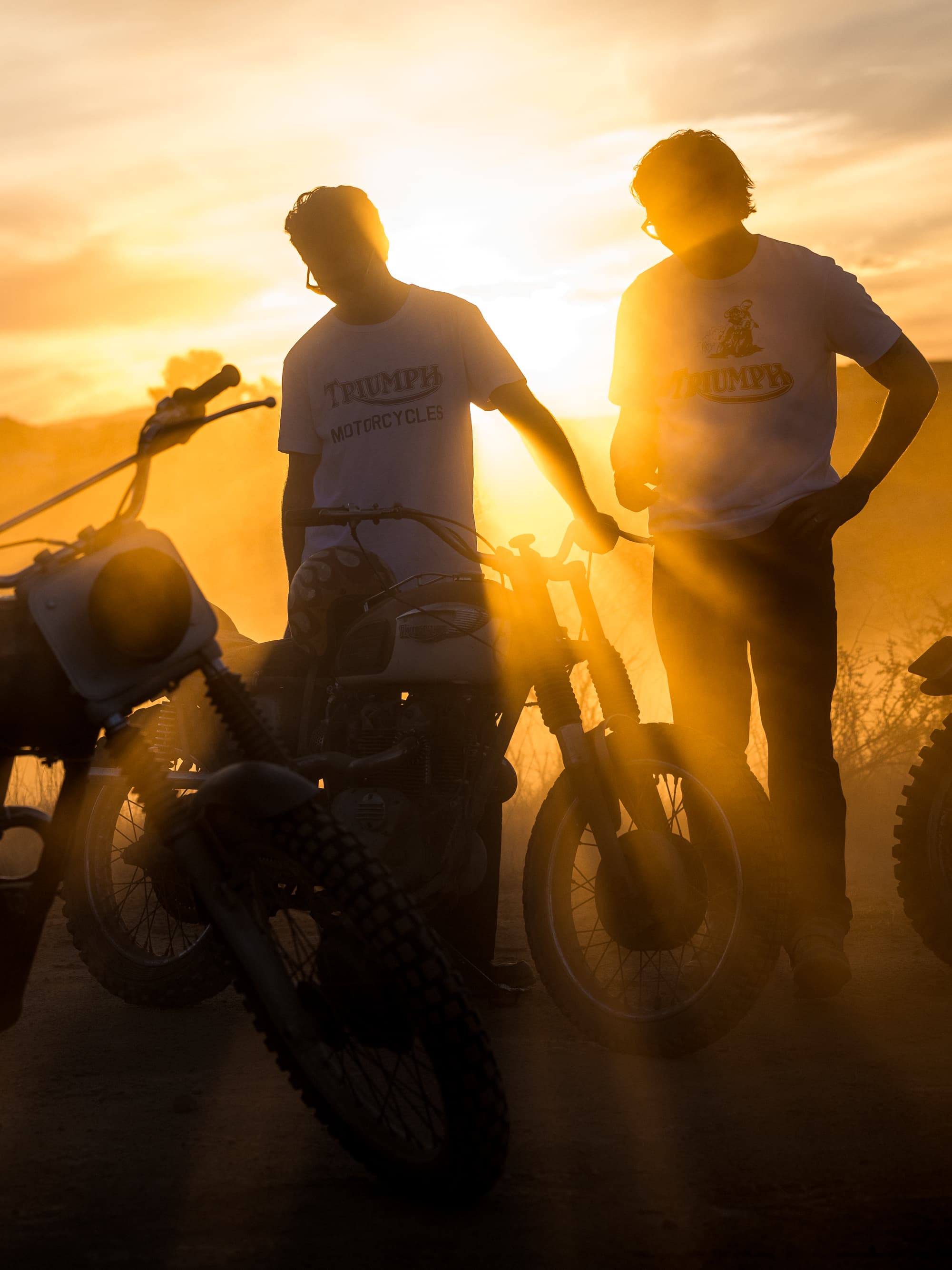 Group of men riding Triumph bikes wearing Triumph Heritage clothing