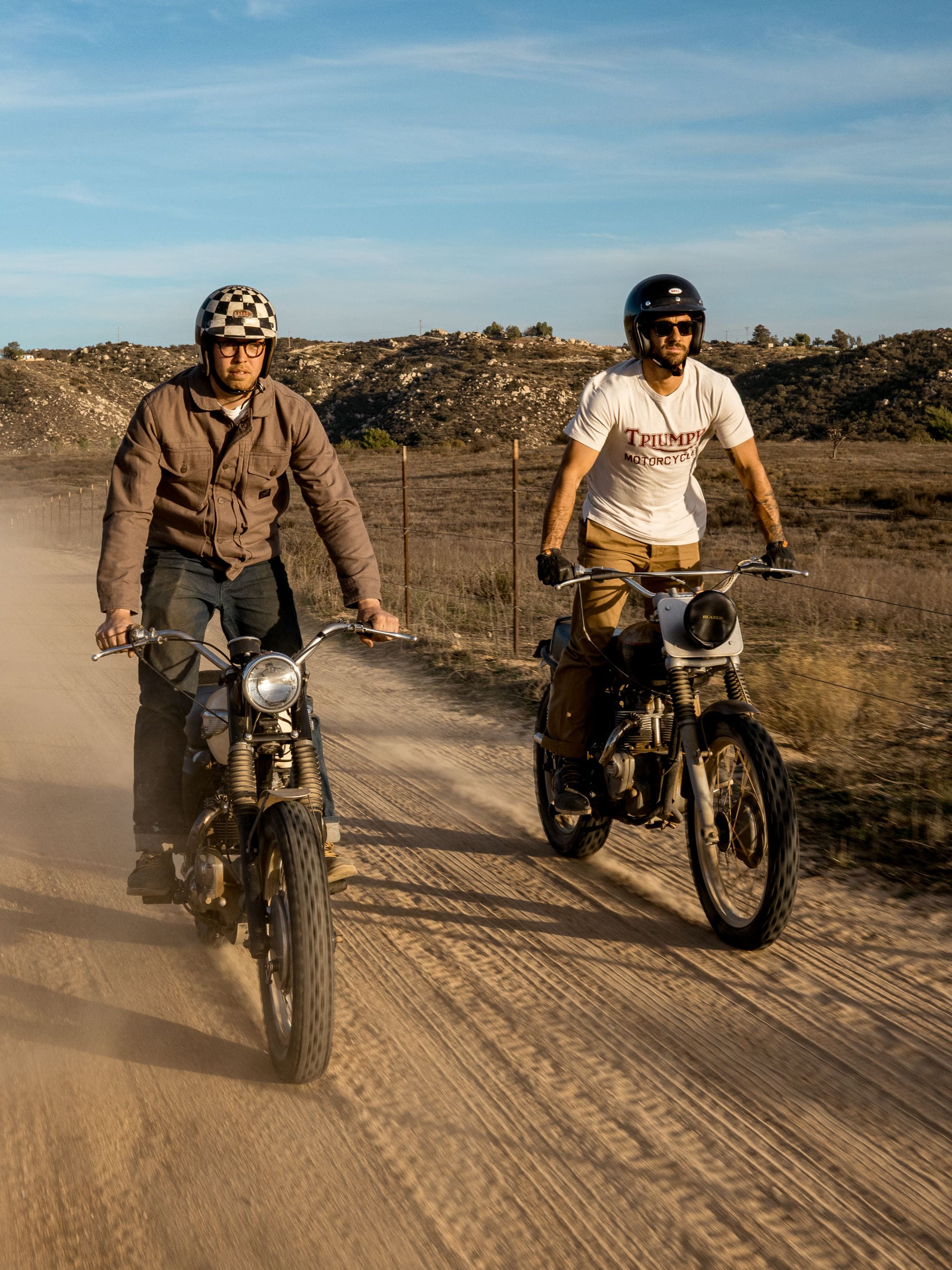 Group of men riding in the desert wearing Triumph Heritage Clothing